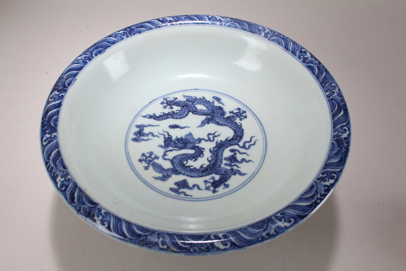 A Chinese Vividly-detailed Dragon-decorating Porcelain Cup: A Chinese Vividly-detailed Dragon-decorating Porcelain Cup. Height: 4.75 (inch). Opening Diameter: 10.75 (inch).