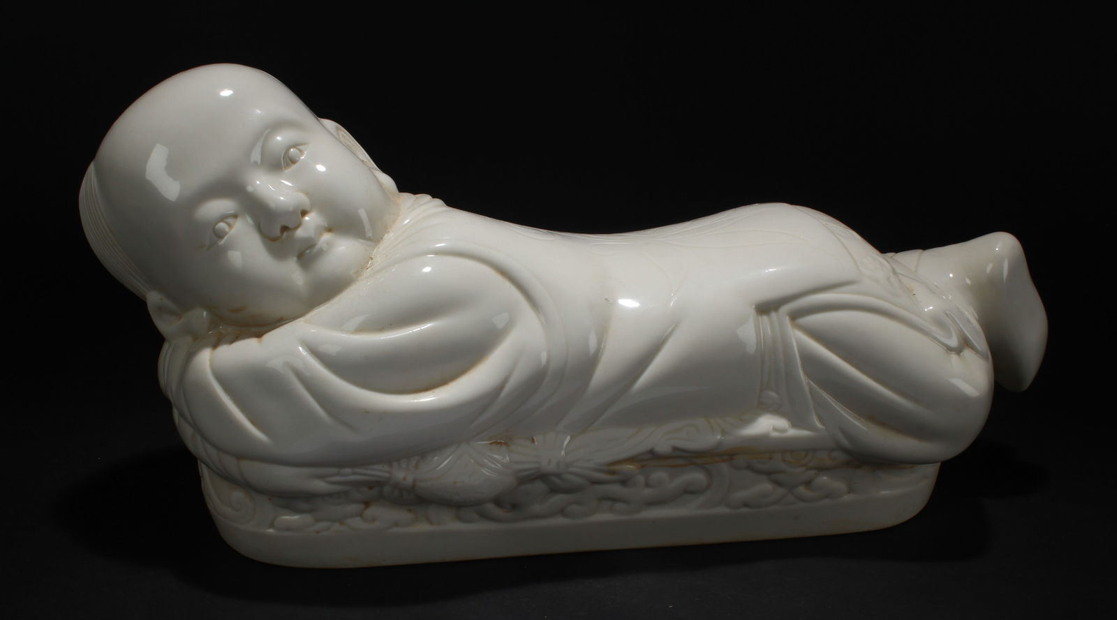 A Chinese Joyful-kid Porcelain Display Statue: A Chinese Joyful-kid Porcelain Display Statue . Height: 7 (inch). Length: 15 (inch).