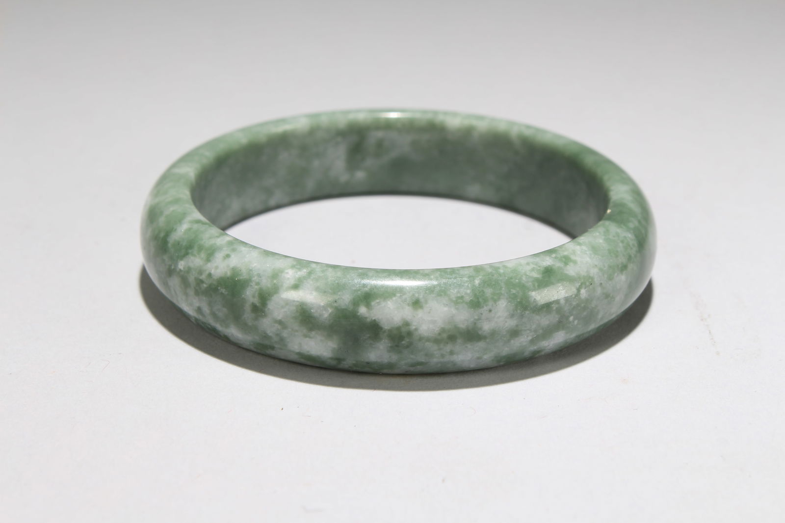 A Chinese Bangel Display: A Chinese Bangel Display . Opening Diameter: 3.25 (inch).