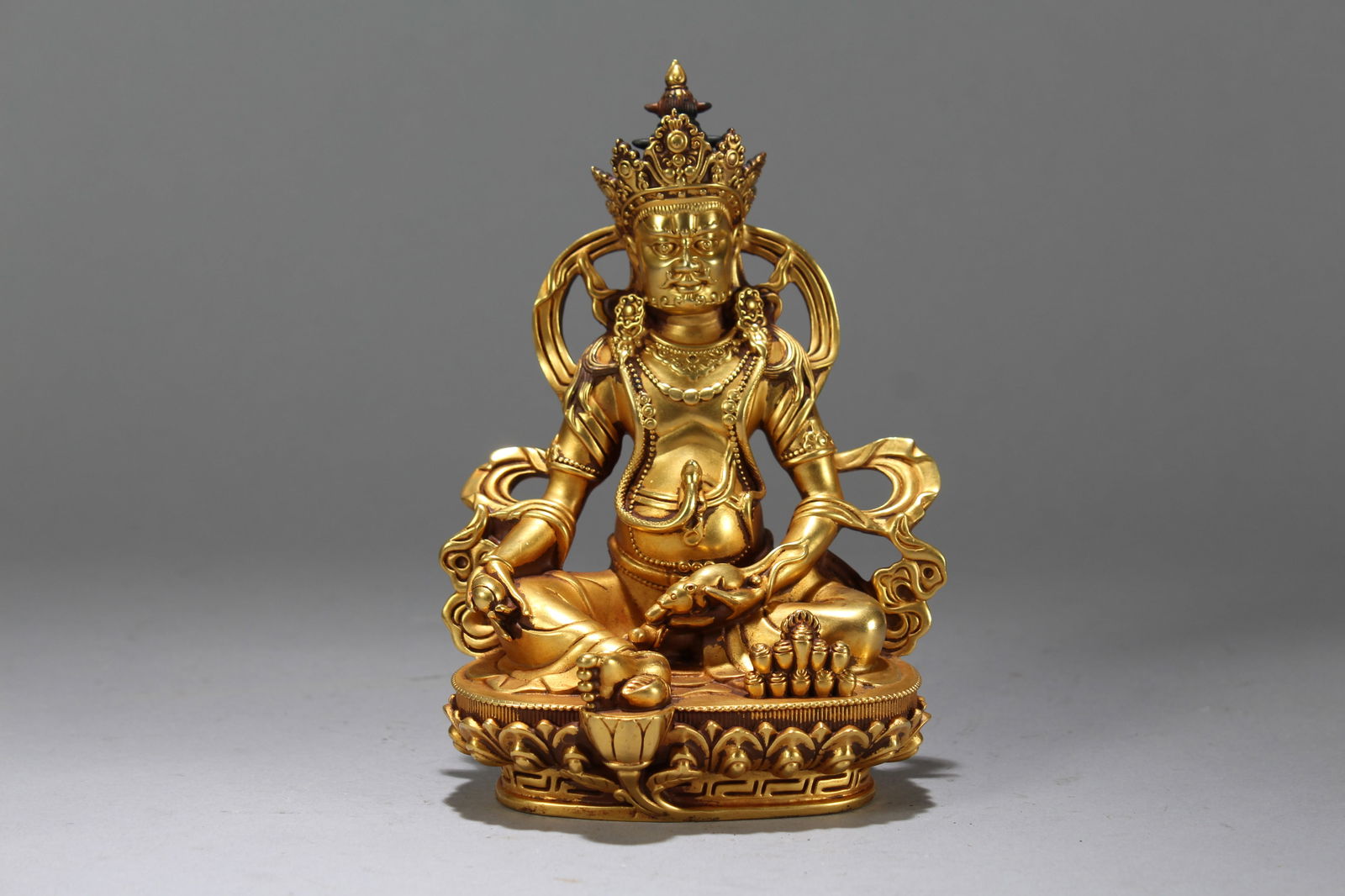 A Chinese Gilt Vividly-detailed Religious Fortune Buddha Statue: A Chinese Gilt Vividly-detailed Religious Fortune Buddha Statue. Height: 6.25 (inch). Width: 4 (inch). Length: 3 (inch).