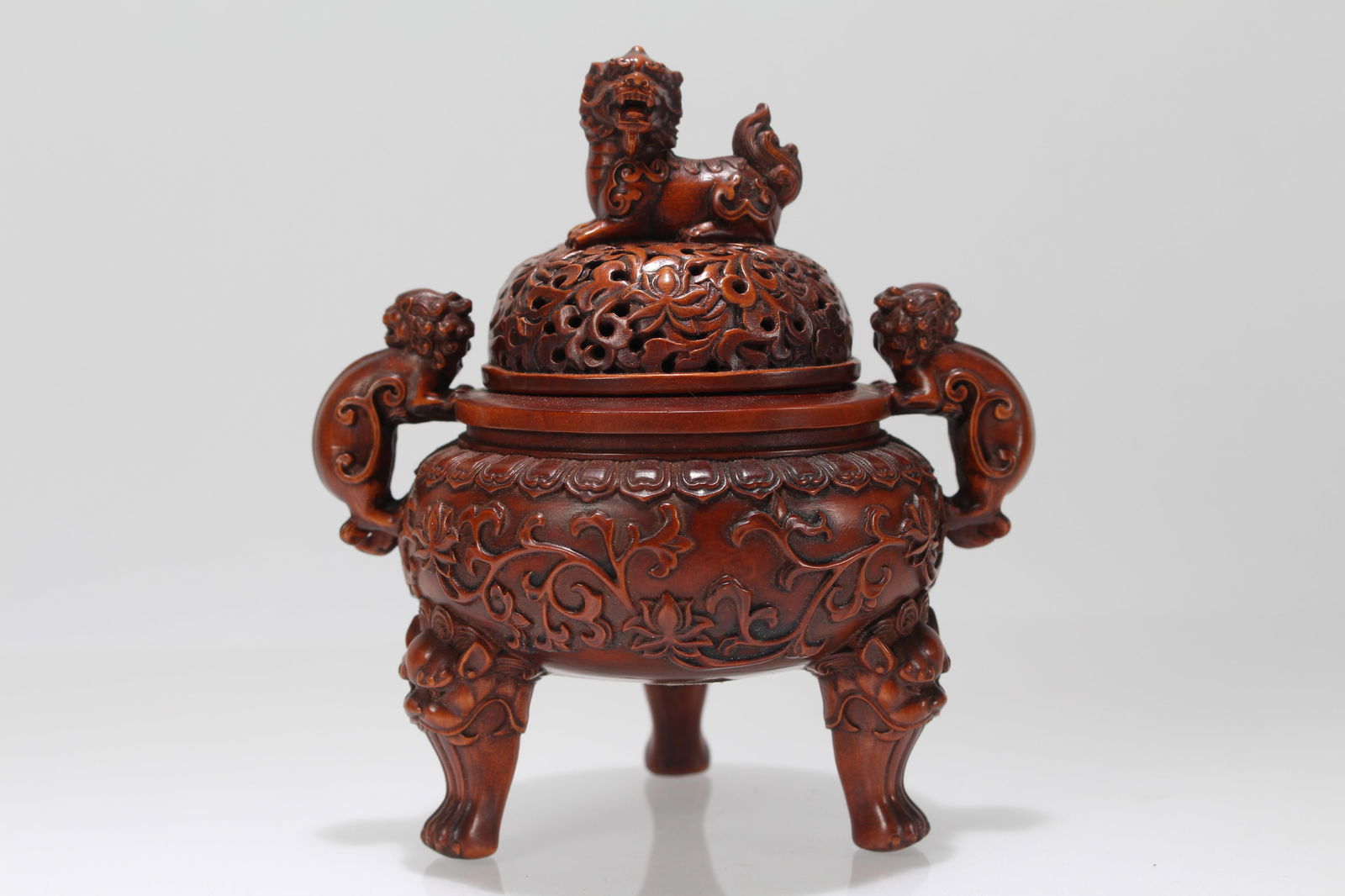 A Chinese Tri-podded Lidded Duo-handled Fortune Censer: A Chinese Tri-podded Lidded Duo-handled Fortune Censer . Height: 4.5 (inch). Length: 4 (inch).