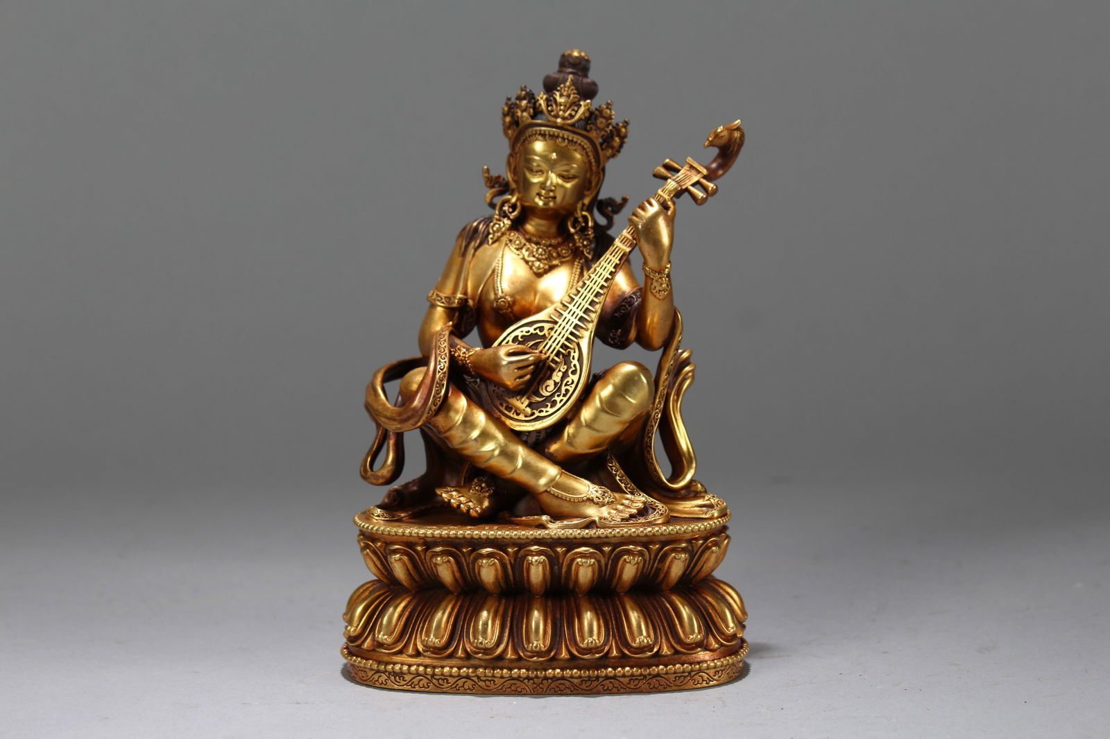 A Chinese Gilt Vividly-detailed Religious Fortune Buddha Statue: A Chinese Gilt Vividly-detailed Religious Fortune Buddha Statue. Height: 6 (inch). Width: 4 (inch). Length: 2.5 (inch).