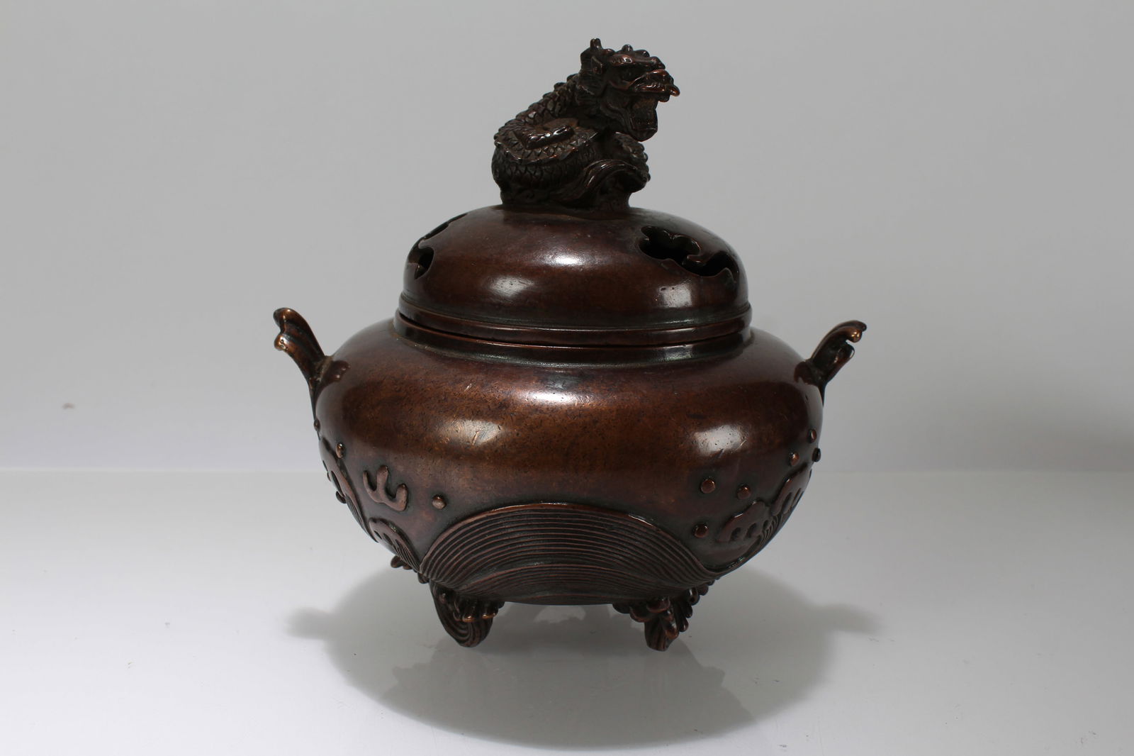 A Chinese Tri-podded Lidded Myth-beast Censer: A Chinese Tri-podded Lidded Myth-beast Censer. Height: 5.5 (inch). Opening Diameter: 8 (inch).