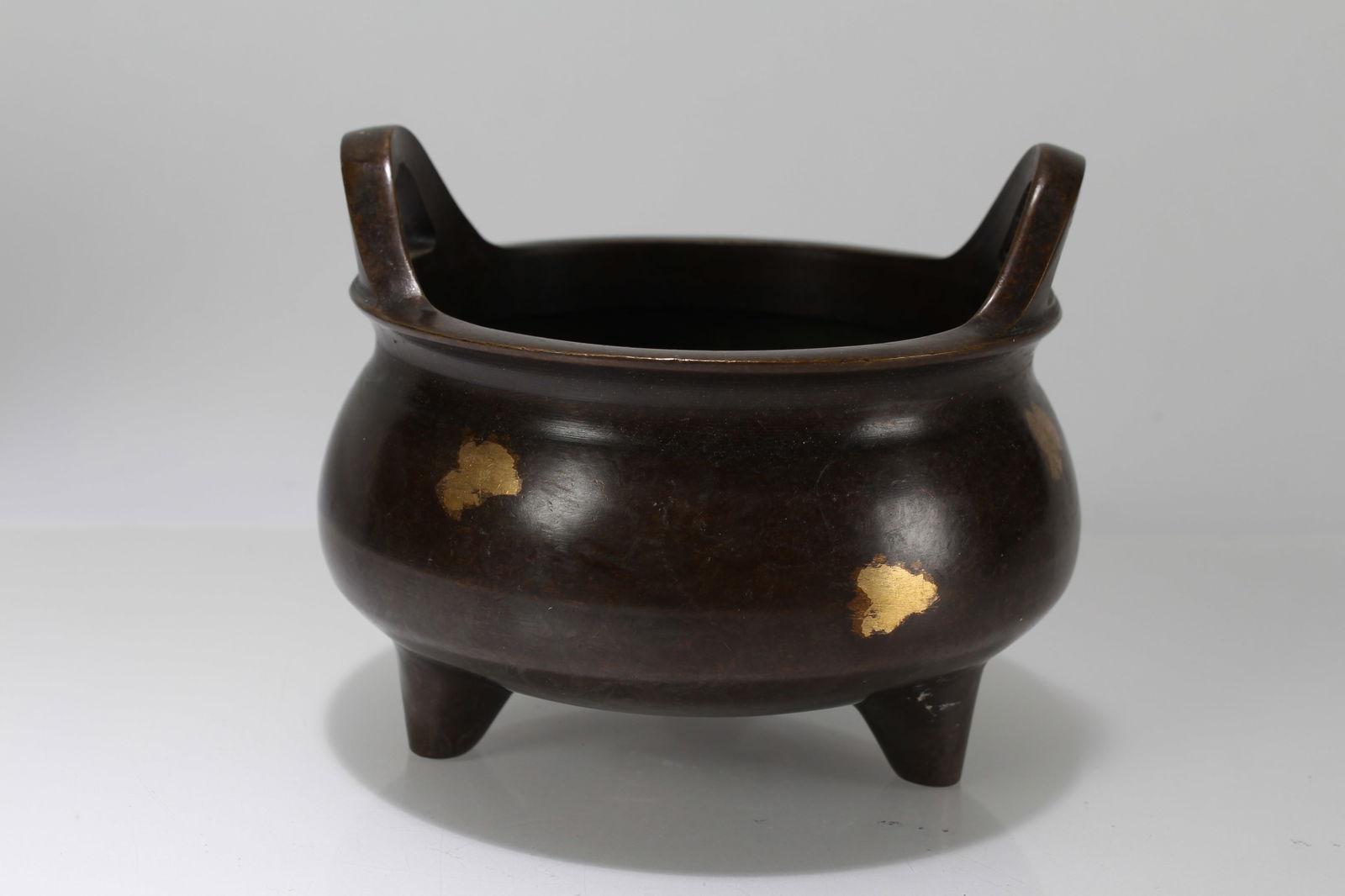 A Chinese Gilt Duo-handling Religious Tri-podded Censer: A Chinese Gilt Duo-handling Religious Tri-podded Censer. Height: 3 (inch). Opening Diameter: 7 (inch).
