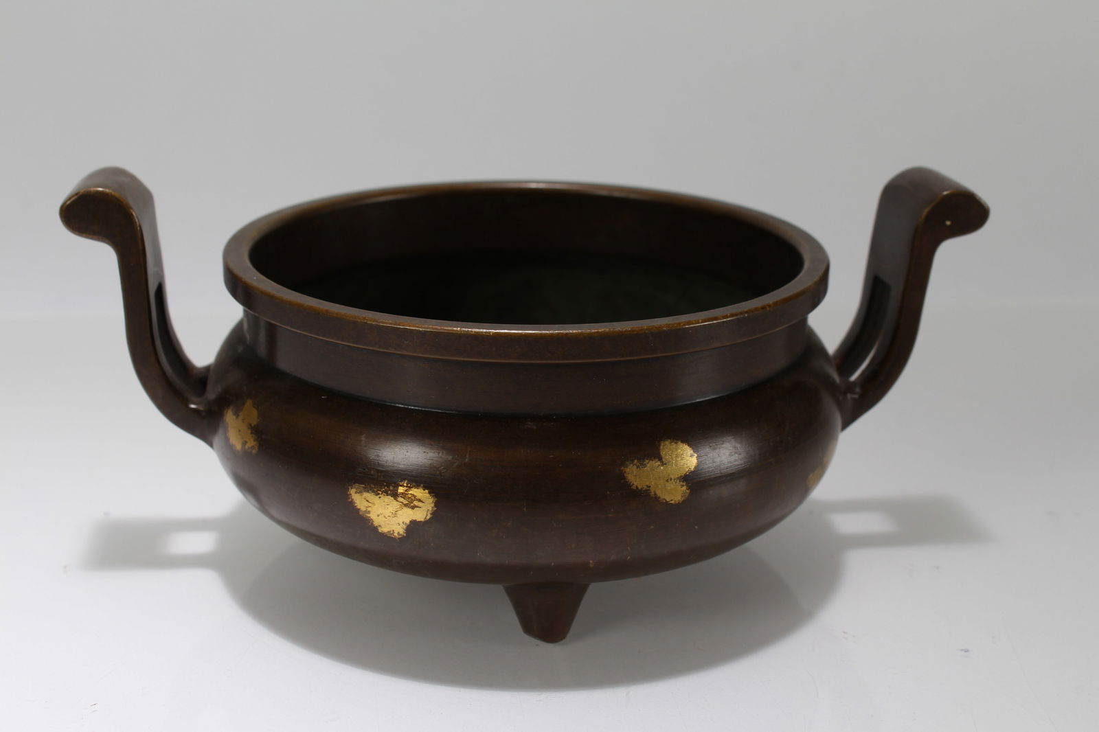 A Chinese Massive Gilt Duo-handling Religious Tri-podded Censer: A Chinese Massive Gilt Duo-handling Religious Tri-podded Censer. Height: 4 (inch). Opening Diameter: 7 (inch).