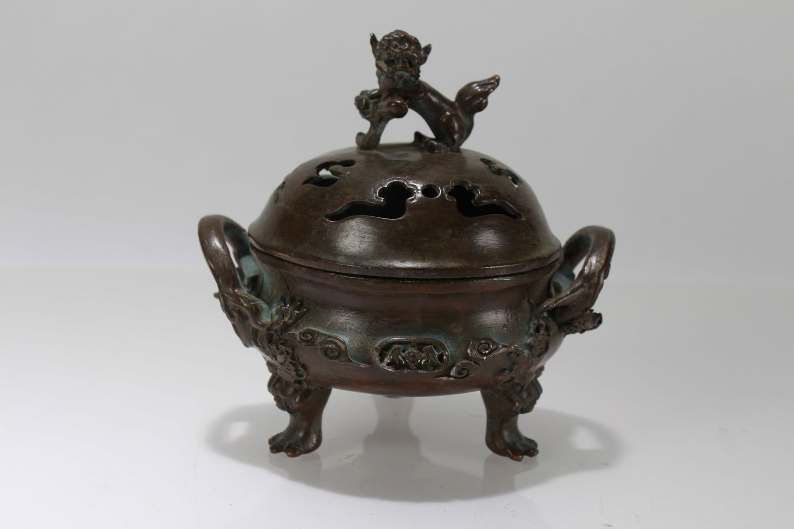 A Chinese Religious Tri-podded Lidded Myth-beast Censer: A Chinese Religious Tri-podded Lidded Myth-beast Censer. Height: 4 (inch). Opening Diameter: 4 (inch).