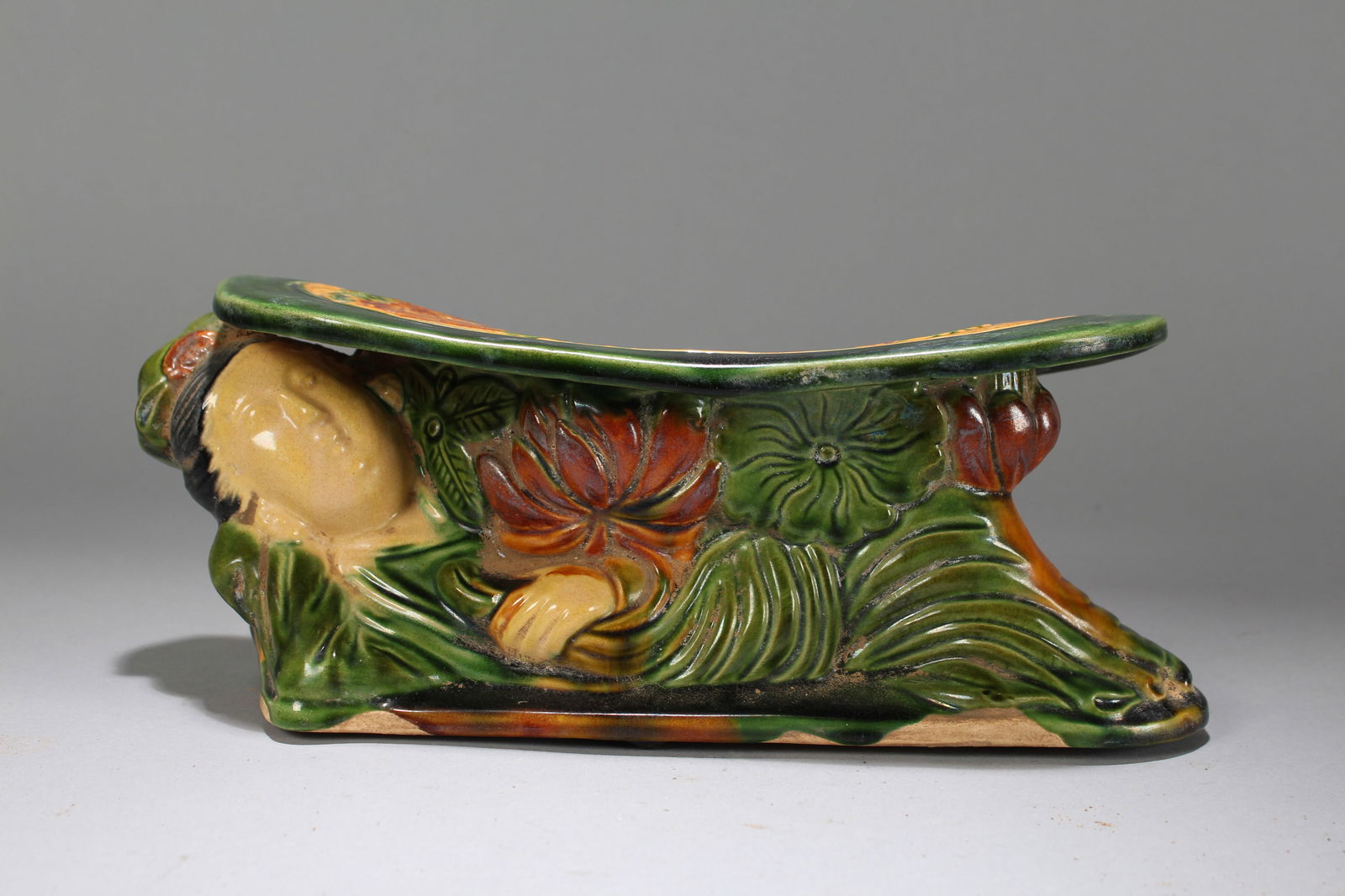 A Chinese Religious Tri-colored-framing Fortune Porcelain Statue: A Chinese Religious Tri-colored-framing Fortune Porcelain Statue. Height: 4 (inch). Width: 6 (inch). Length: 12 (inch).