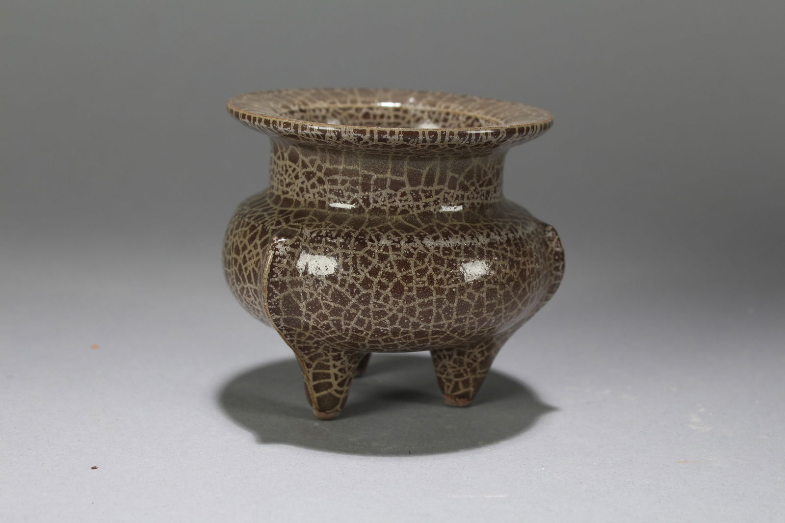 A Chinese Tri-podded Crack-fortune Porcelain Censer: A Chinese Tri-podded Crack-fortune Porcelain Censer. Height: 3 (inch). Width: 3.5 (inch).
