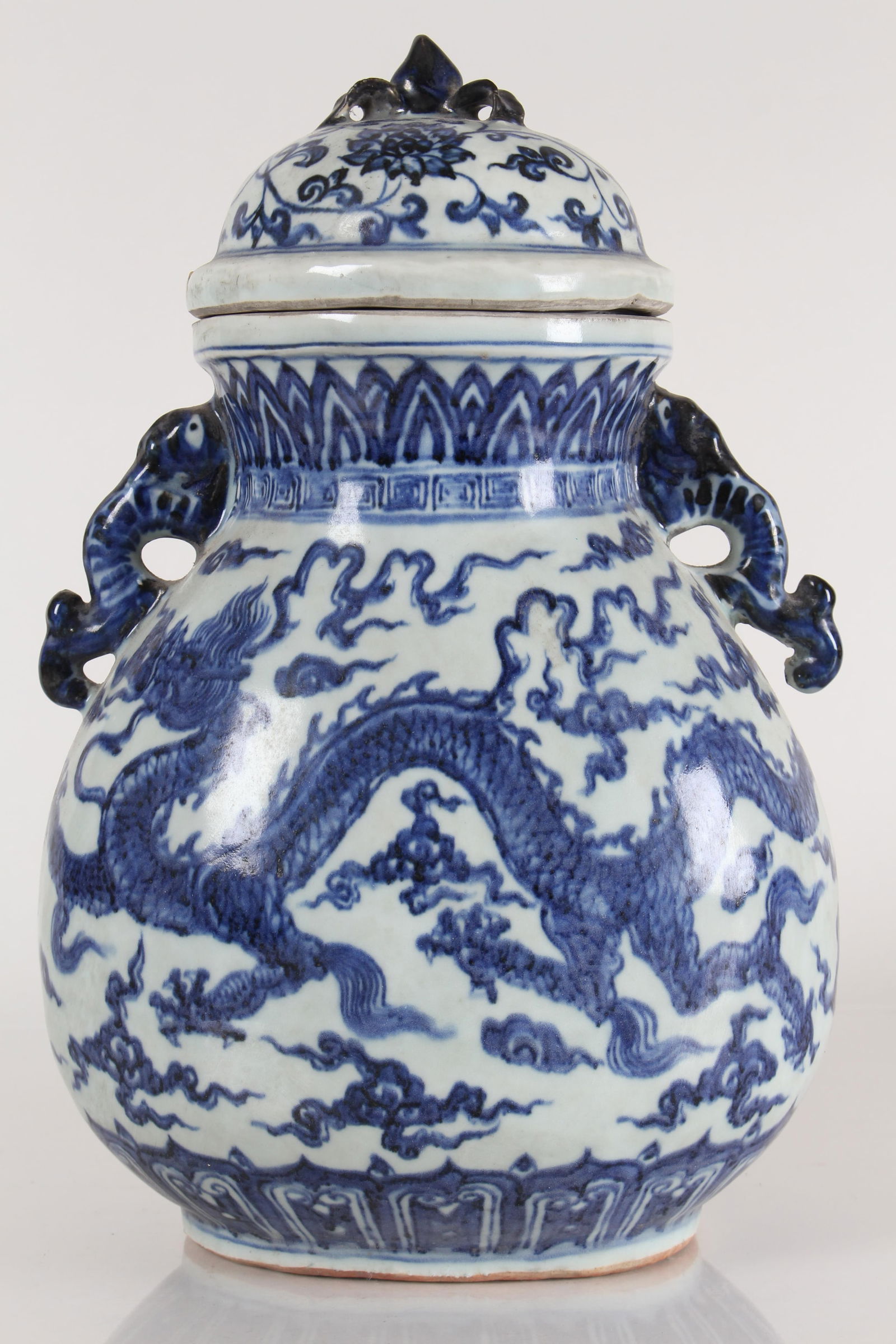 A Chinese Dragon-decorating Duo-handled Blue and White Porcelain Fortune Vase: A Chinese Dragon-decorating Duo-handled Blue and White Porcelain Fortune Vase . Height: 12.75 (inch).