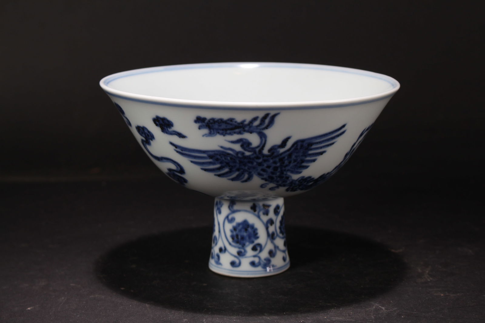 A Chinese Blue and White Porcelain Phoenix-framing Tall-end Cup: A Chinese Blue and White Porcelain Phoenix-framing Tall-end Cup. Height: 4.25 (inch). Opening Diamter: 6.75 (inch).