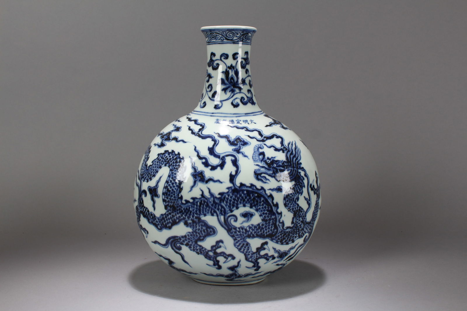 A Chinese Blue and White Dragon-decorating Massive Porcelain Fortune Vase: A Chinese Blue and White Dragon-decorating Massive Porcelain Fortune Vase. Height: 12.75 (inch). Width: 9 (inch). Length: 6 (inch).