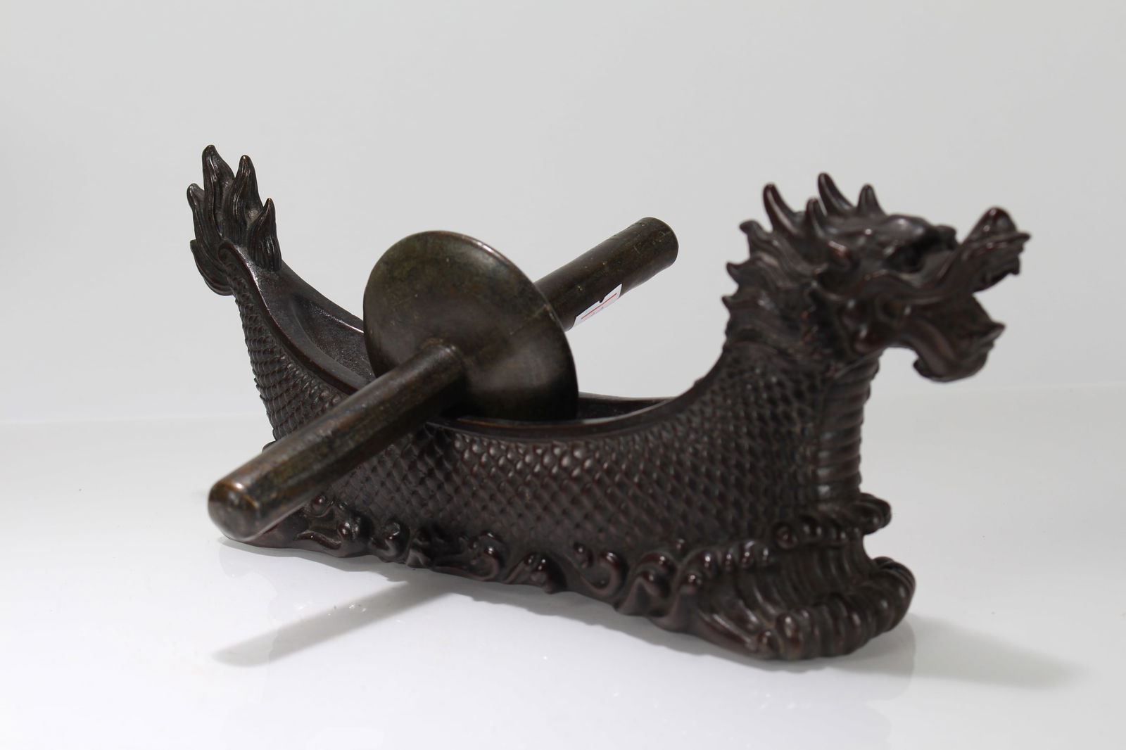A Chinese Dragon-decorating Fortune Statue: A Chinese Dragon-decorating Fortune Statue . Height: 4 (inch). Length: 10.75 (inch).