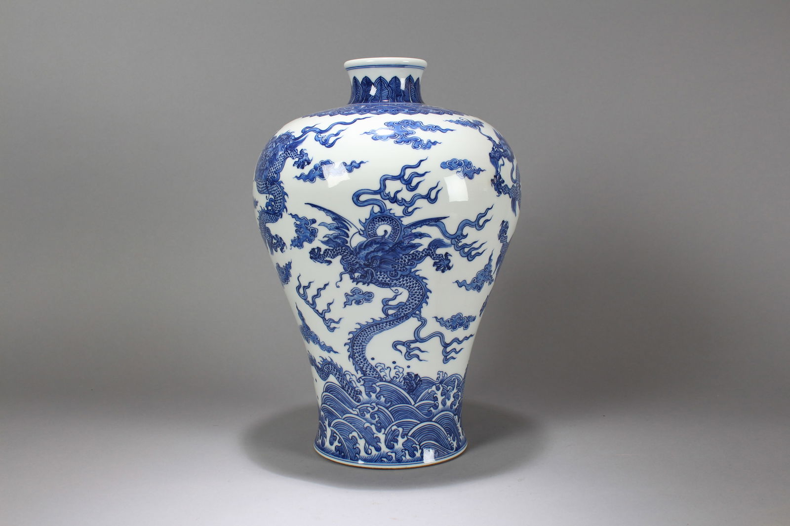 A Chinese Blue and White Dragon-decorating Porcelain Fortune Vase: A Chinese Blue and White Dragon-decorating Porcelain Fortune Vase. Height: 14.5 (inch). Width: 9 (inch).