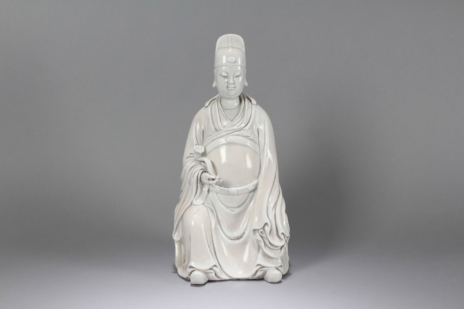 A Chinese De Blac Porcelain Fortune Statue: A Chinese De Blac Porcelain Fortune Statue. Height: 13.5 (inch). Width: 6.5 (inch). Length: 6 (inch)