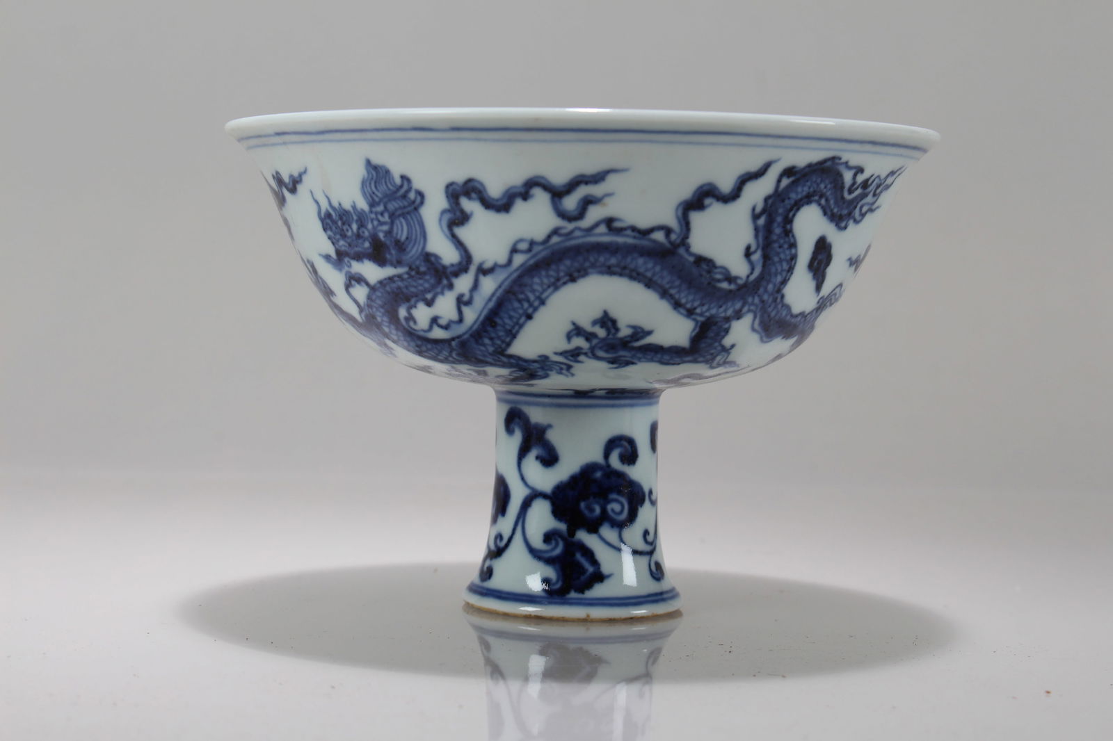 A Chinese Dragon-decorating Blue and White Porcelain Cup: A Chinese Dragon-decorating Blue and White Porcelain Cup. Height: 4 (inch). Opening Diameter: 6 (inch).