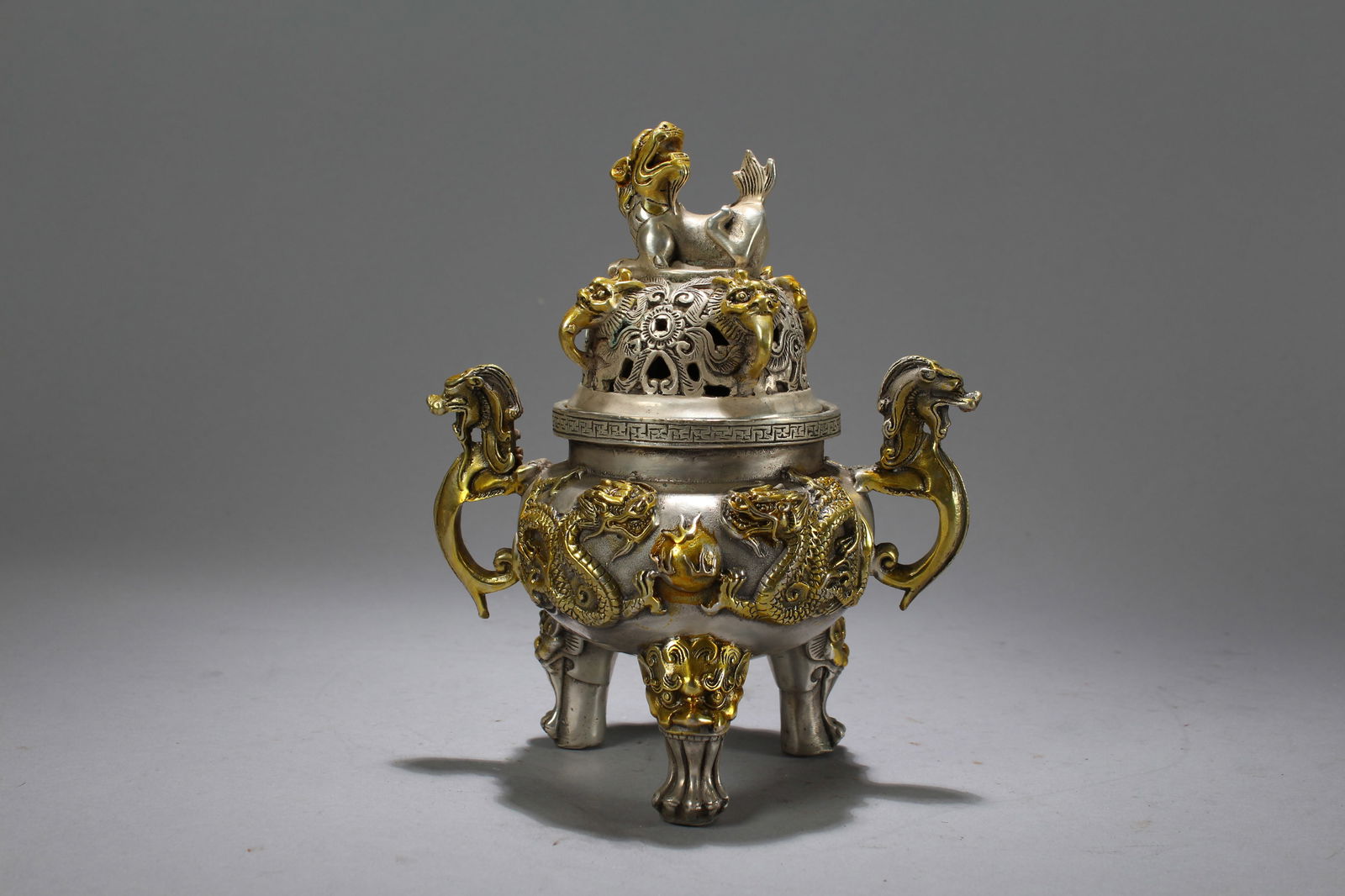 A Chinese Tri-podded Lidded Duo-handled Fortune Censer: A Chinese Tri-podded Lidded Duo-handled Fortune Censer . Height: 7 (inch). Length: 6 (inch).