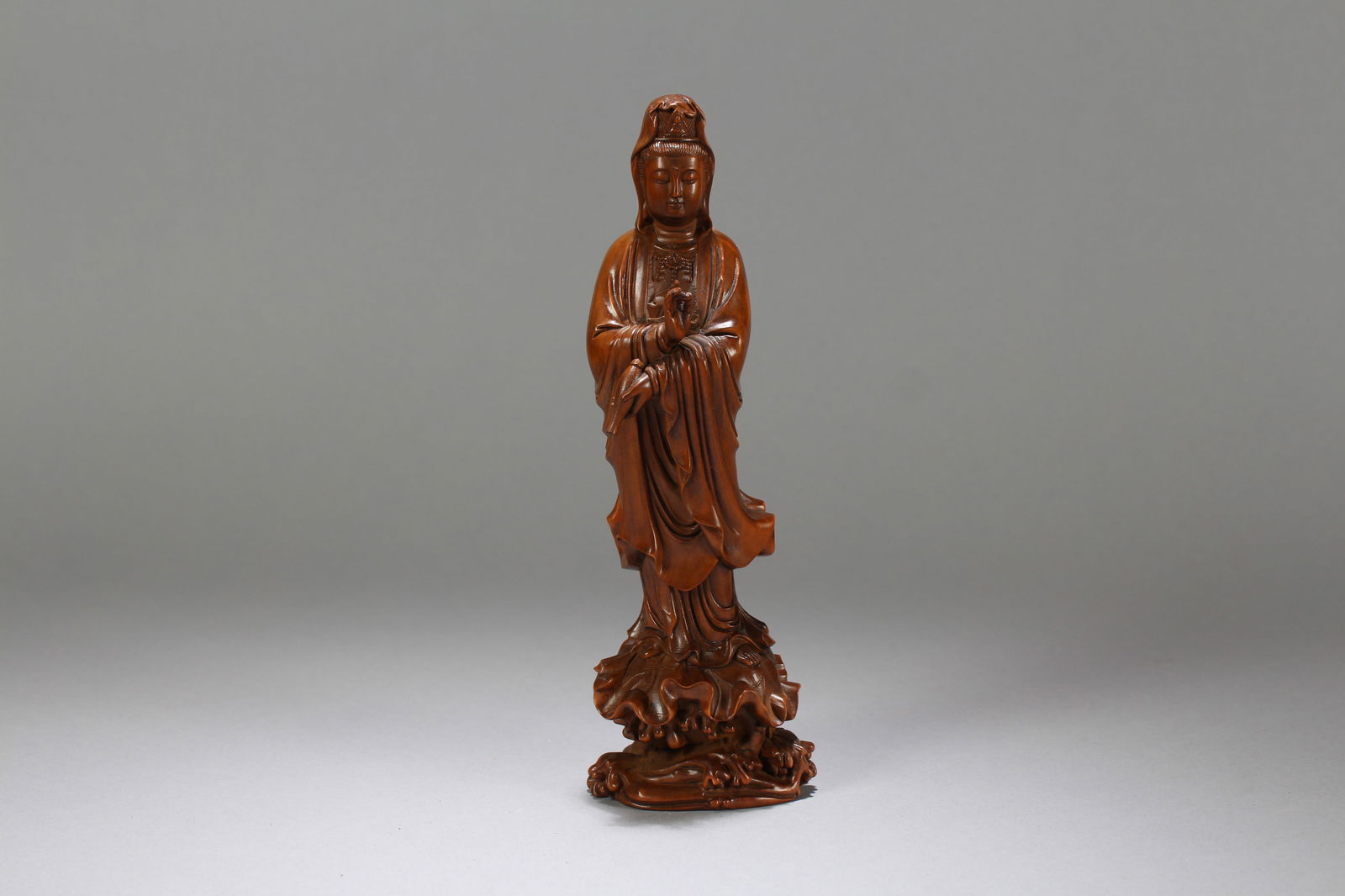 A Chinese Religious Wooden Guanyin Statue: A Chinese Religious Wooden Guanyin Statue. Height: 8.25 (inch). Width: 2.75 (inch)