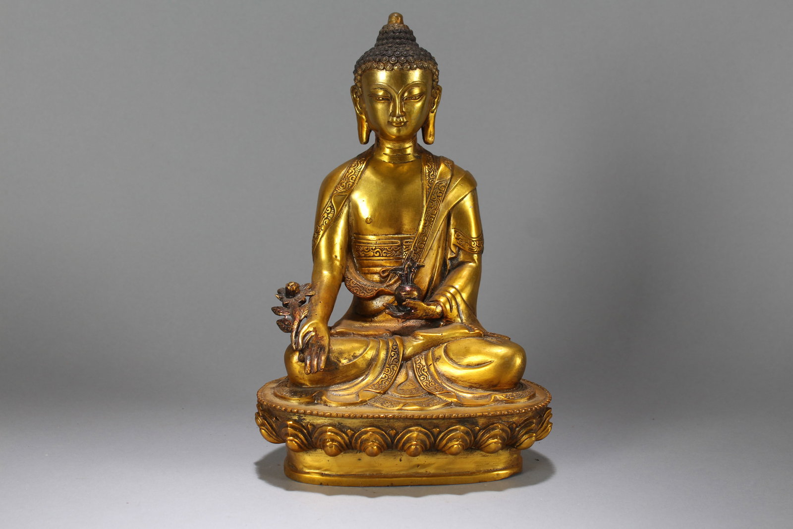 A Chinese Vividly-detailed Gilt Fortune Buddha Statue: A Chinese Vividly-detailed Gilt Fortune Buddha Statue. Height : 9.75 (inch). Width : 7 (inch). Length : 5 (inch).