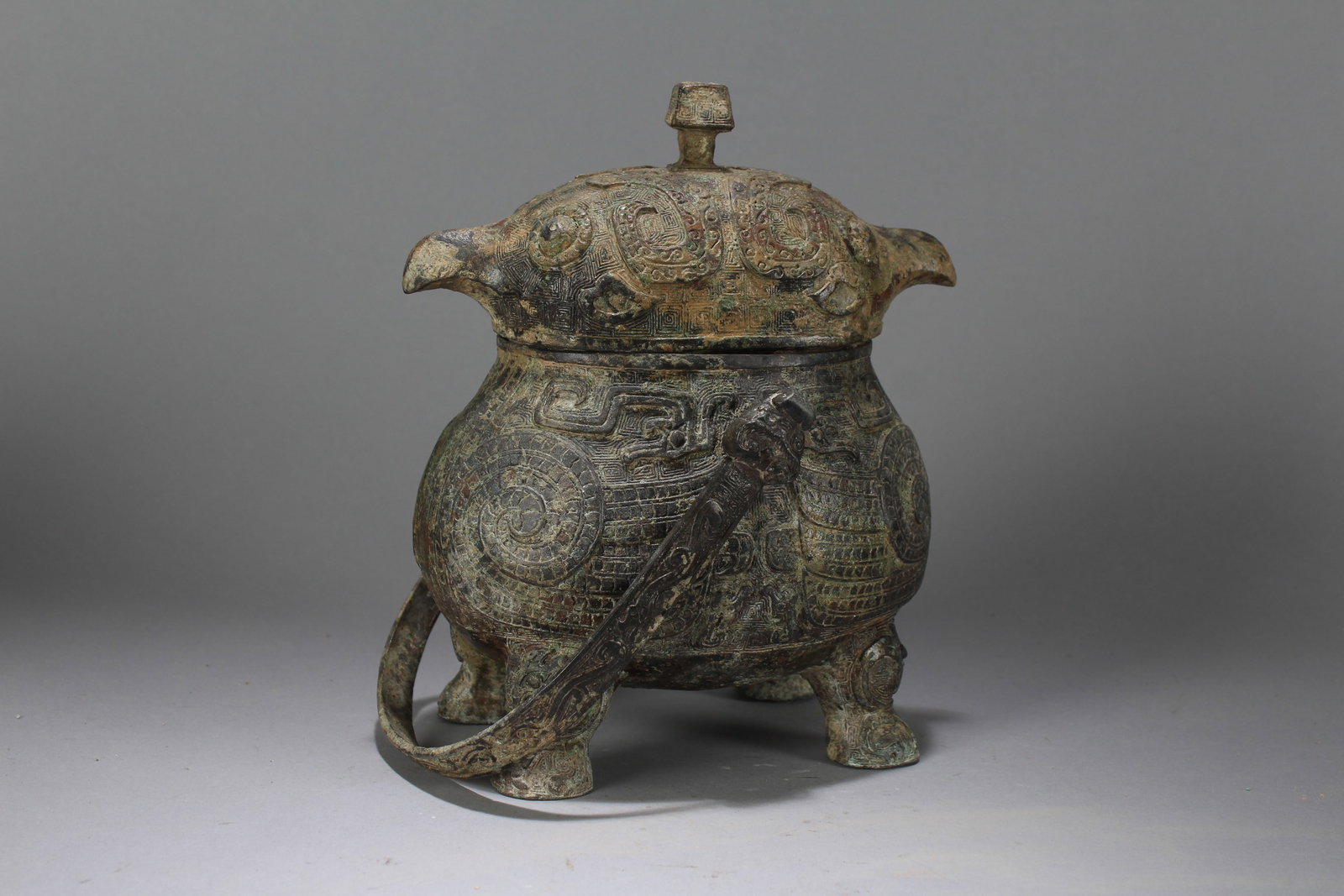 A Chinese Lidded Anicent-framing Fortune Bronze Vessel: A Chinese Lidded Anicent-framing Fortune Bronze Vessel. Height : 9 (inch). Width : 7 (inch). Length : 5 (inch).