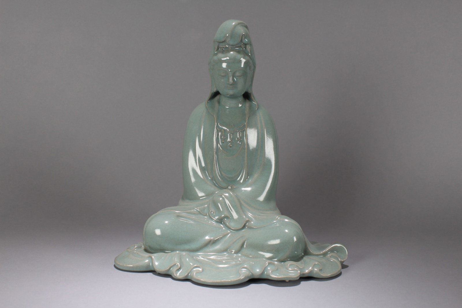 A Chinese Vividly-detailed Religious Fortune Porcelain Statue: A Chinese Vividly-detailed Religious Fortune Porcelain Statue. Height: 12 (inch). Width: 11 (inch)