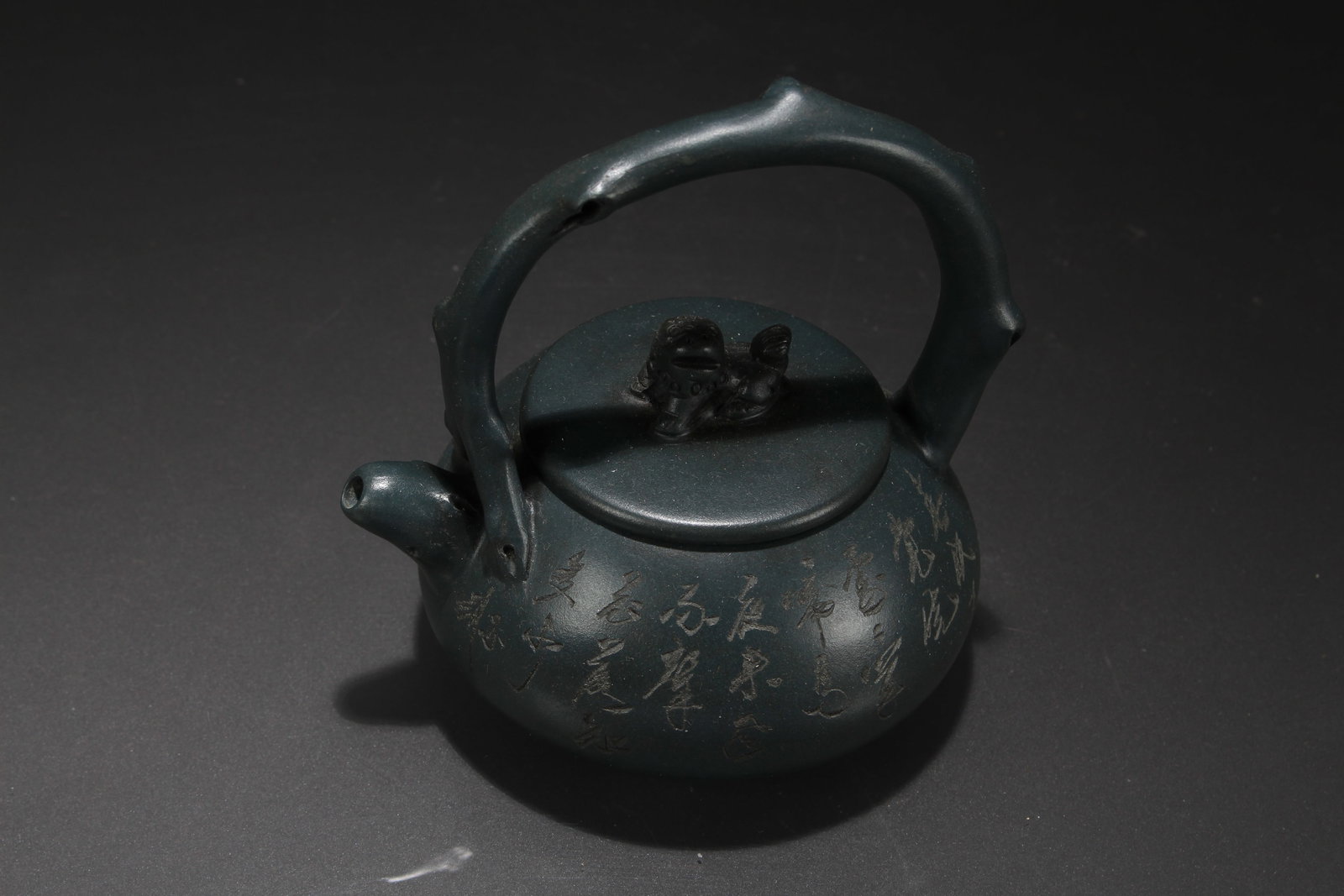 A Chinese High-handled Tea Pot: A Chinese High-handled Tea Pot . Height: 5.25 (inch). Length: 5 (inch).