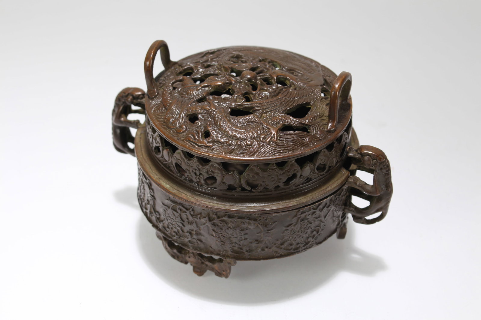 A Chinese Duo-handling Tri-podded Lidded Fortune Censer: A Chinese Duo-handling Tri-podded Lidded Fortune Censer. Height: 4 (inch). Length: 5.75 (inch).
