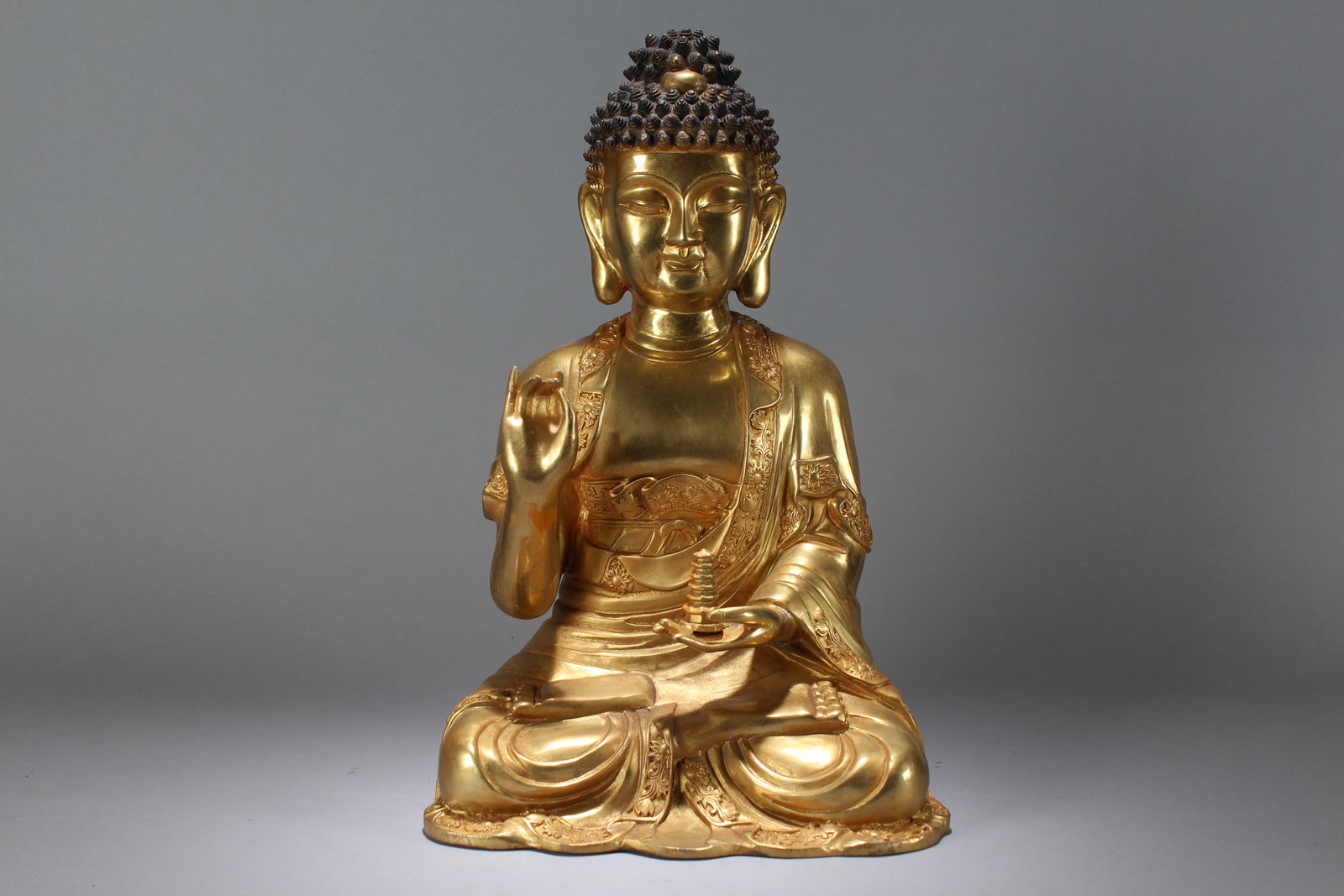A Chinese Gilt Religious Fortune Massive Buddha Statue: A Chinese Gilt Religious Fortune Massive Buddha Statue. Height: 17 (inch). Width: 10.5 (inch). Length: 7.5 (inch).