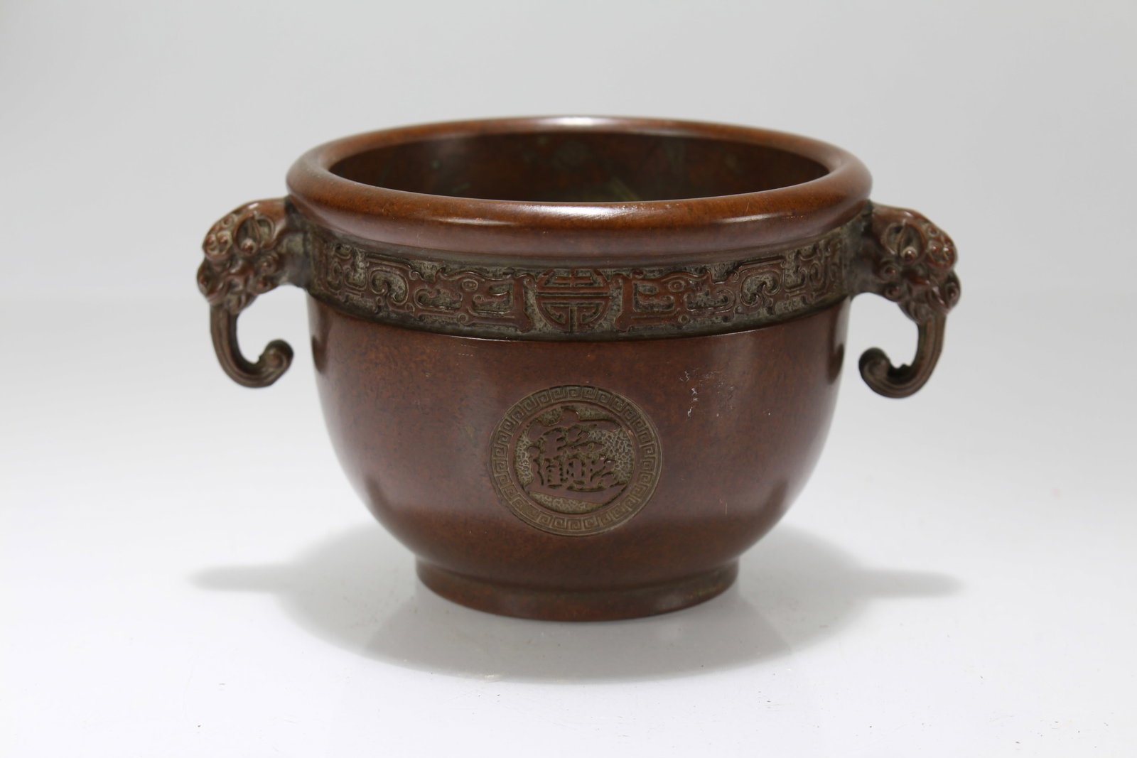 A Chinese Duo-handling Lidded Wealth-Fortune-icon Censer: A Chinese Duo-handling Lidded Wealth-Fortune-icon Censer. Height: 3 (inch). Length: 5 (inch).
