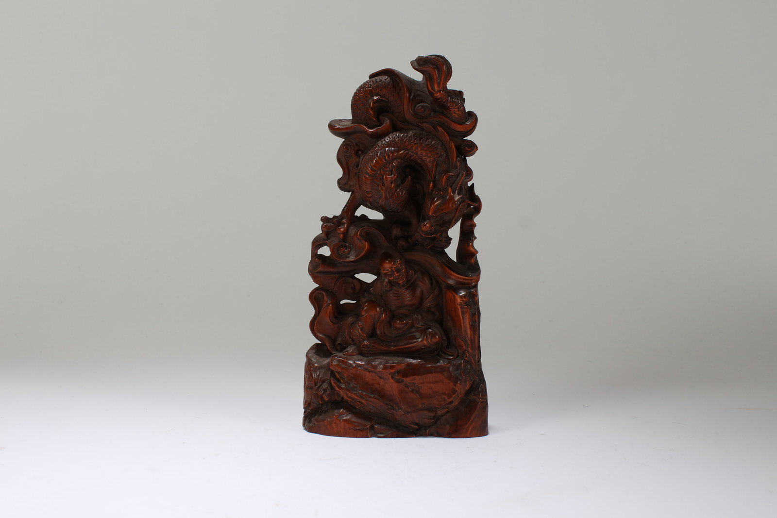 A Chinese Religious Wooden Statue: A Chinese Religious Wooden Statue. Height: 7 (inch). Length: 3.5 (inch). Width: 1.5 (inch).