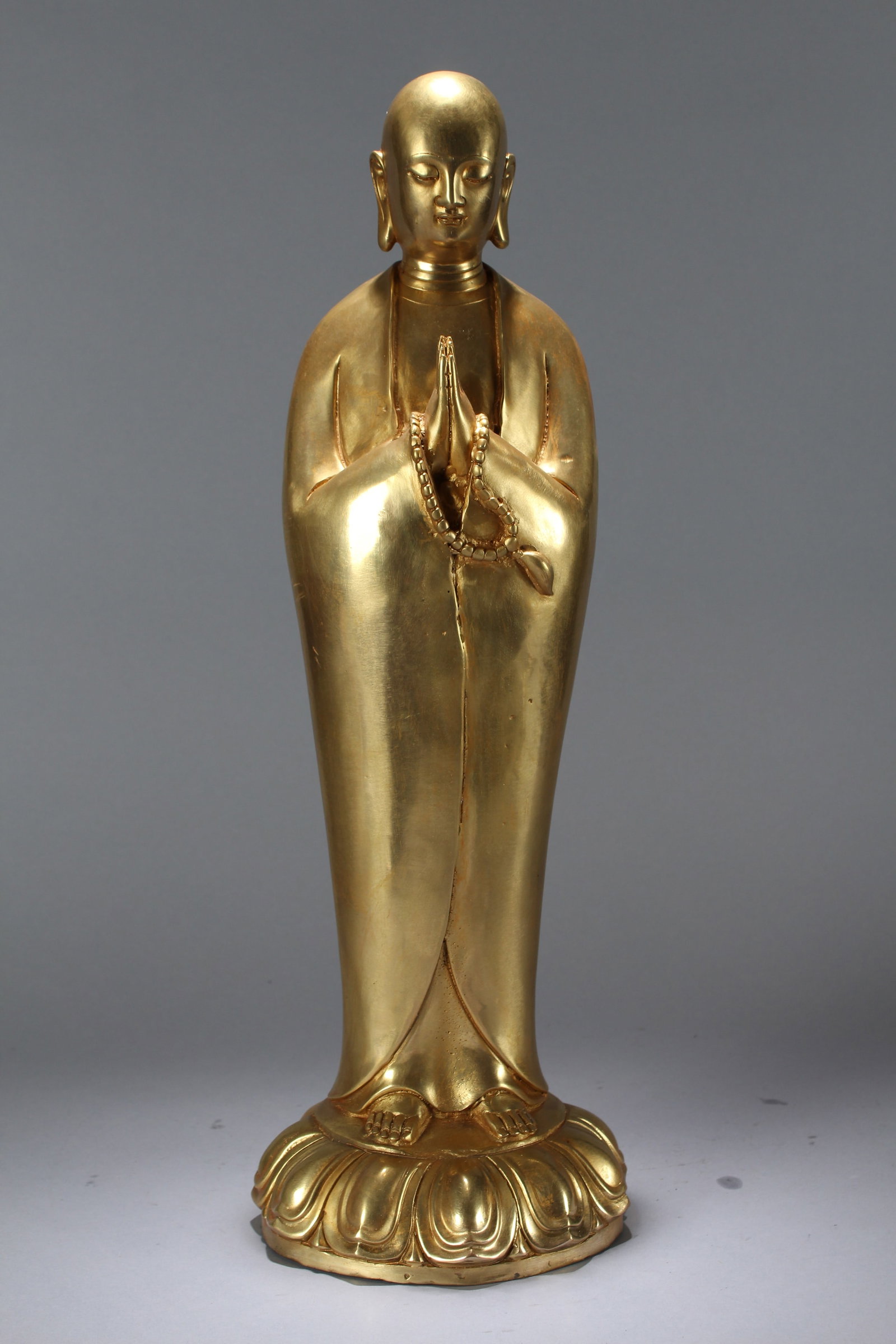 A Chinese Vividly-detailed Gilt Religious Fortune Massive Buddha Statue: A Chinese Vividly-detailed Gilt Religious Fortune Massive Buddha Statue. Height: 19 (inch). Width: 6.5 (inch). Length: (inch).