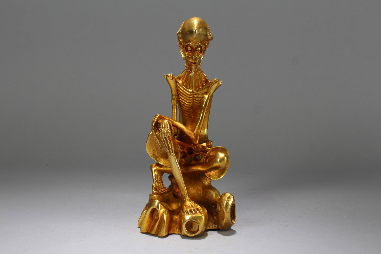 A Chinese Lohan-portrait Gilt Fortune Vividly-detailed Buddha Statue: A Chinese Lohan-portrait Gilt Fortune Vividly-detailed Buddha Statue. Height: 8.75 (inch). Length: 4 (inch). Width: 3.5 (inch).