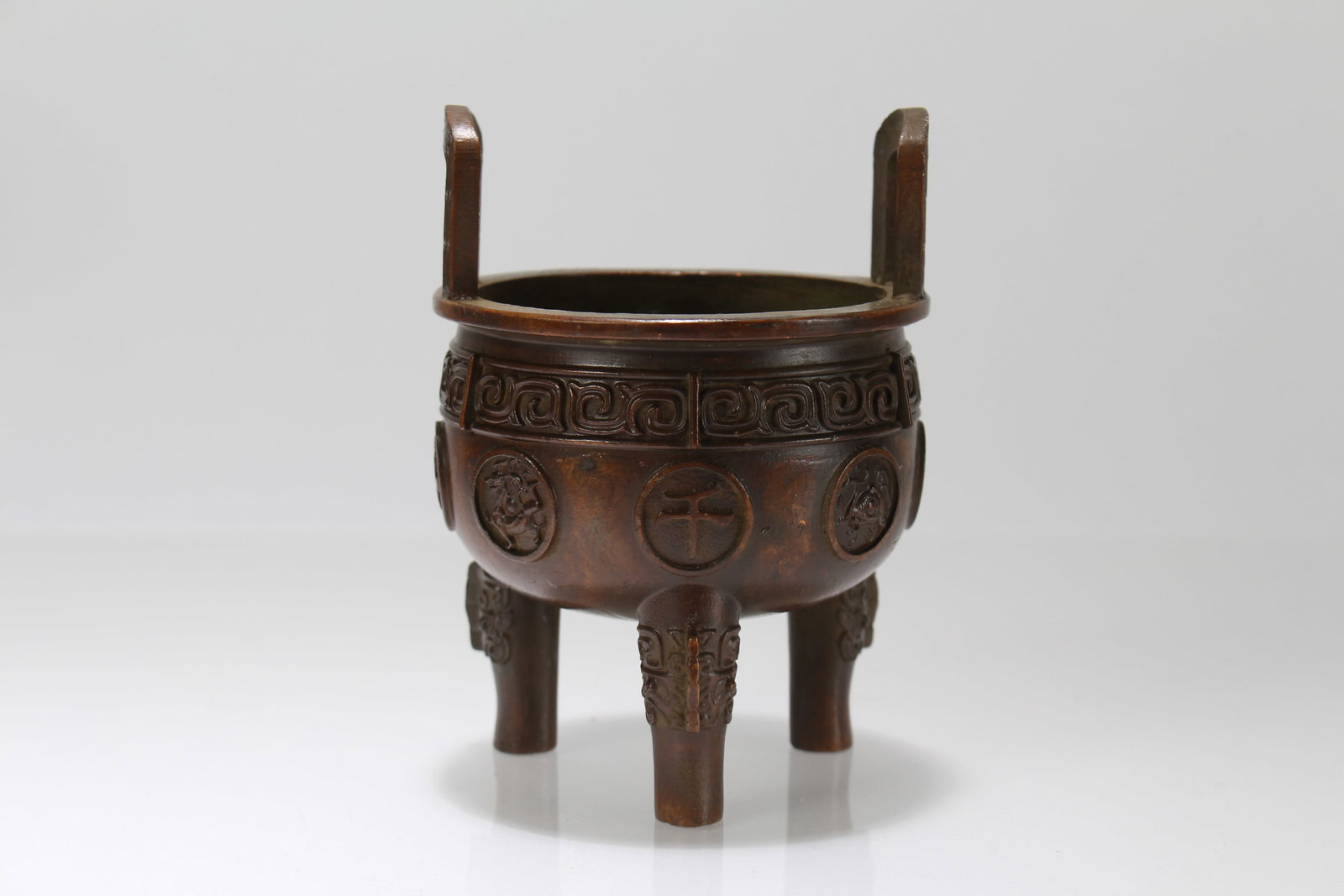 A Chinese Duo-handling Tri-podded Fortune Censer: A Chinese Duo-handling Tri-podded Fortune Censer. Height: 4.25 (inch). Opening Diameter: 3 (inch).