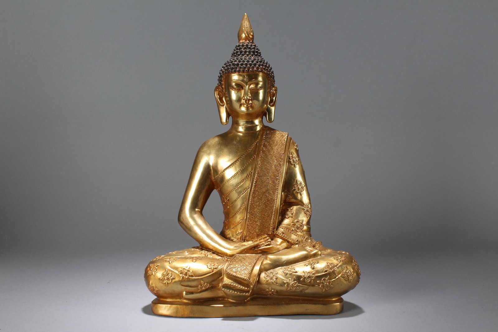 A Chinese Vividly-detailed Gilt Religious Fortune Buddha Statue: A Chinese Vividly-detailed Gilt Religious Fortune Buddha Statue. Height: 15.25 (inch). Width: 10.75 (inch). Length: 5.5 (inch).