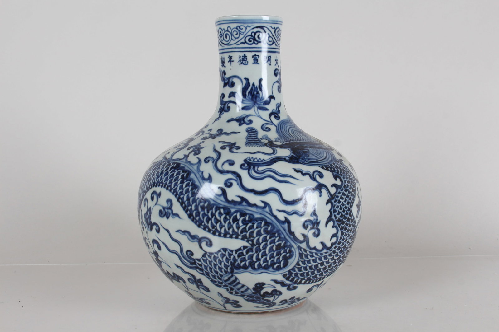 A Chinese Blue and White Detailed Dragon-decorating Porcelain Fortune Vase: A Chinese Blue and White Detailed Dragon-decorating Porcelain Fortune Vase . Height: 11.25 (inch).
