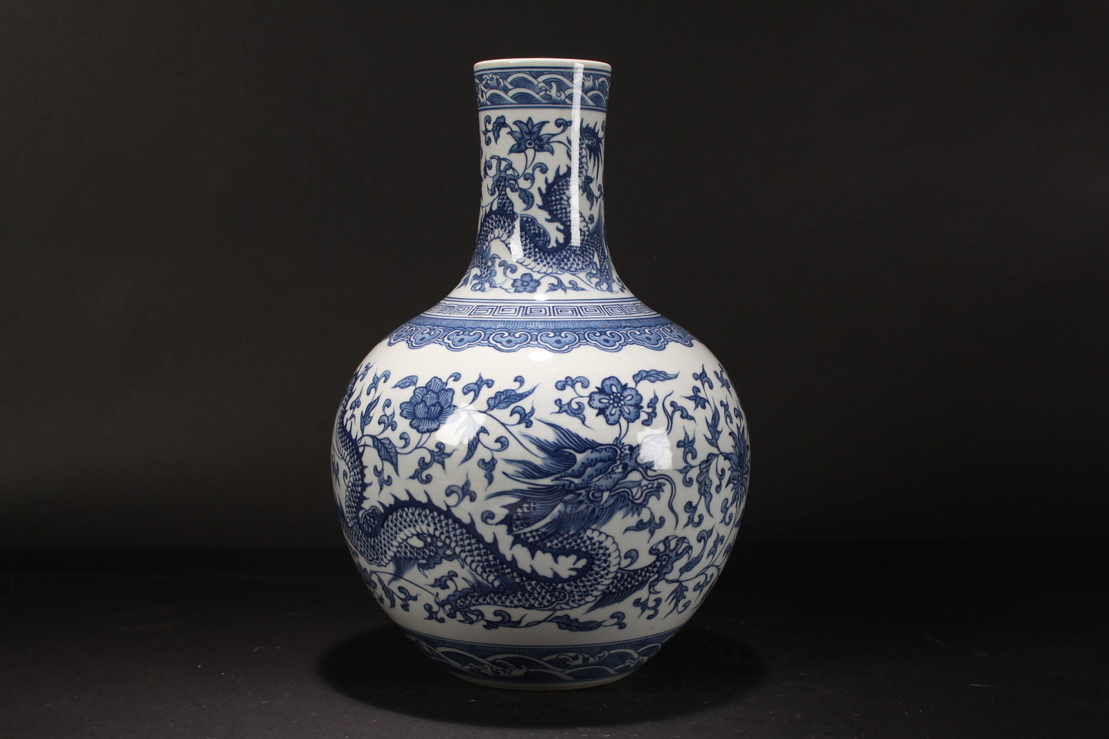 A Chinese Blue and White Dragon-decorating Porcelain Fortune Vase: A Chinese Blue and White Dragon-decorating Porcelain Fortune Vase . Height: 12.5 (inch). Opening Diameter: 2.75 (inch).