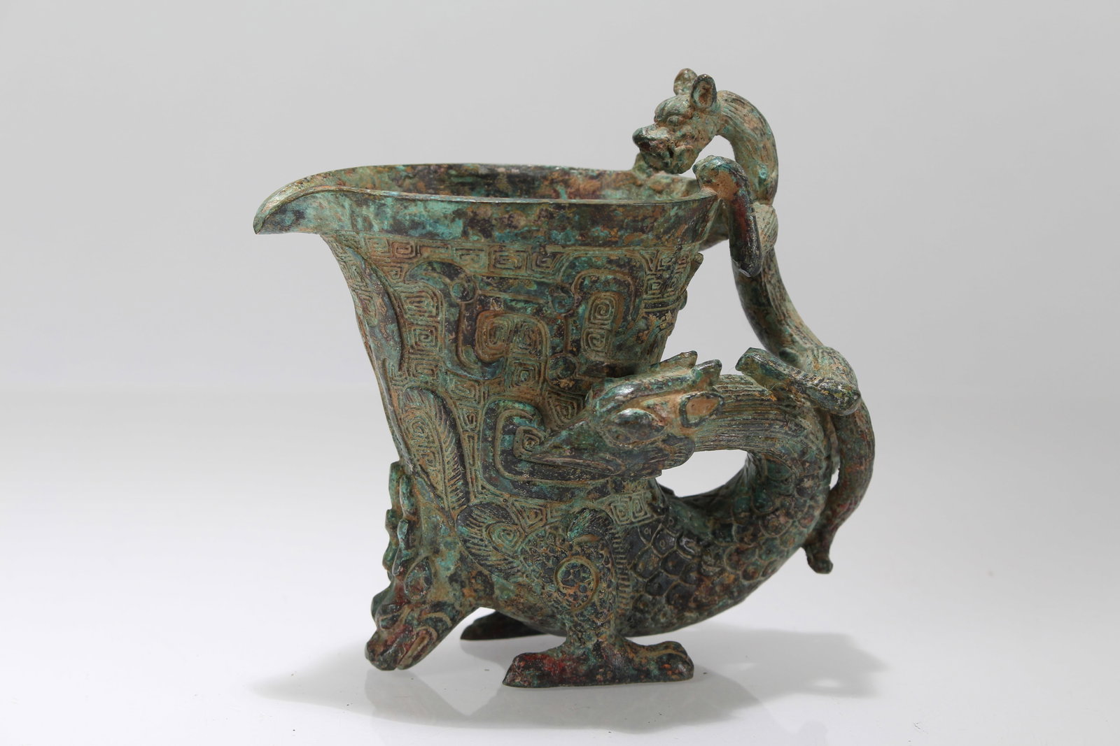 A Chinese Anicent-framing Bronze Vessel: A Chinese Anicent-framing Bronze Vessel. Height: 3.75 (inch). Length: 4.5 (inch).