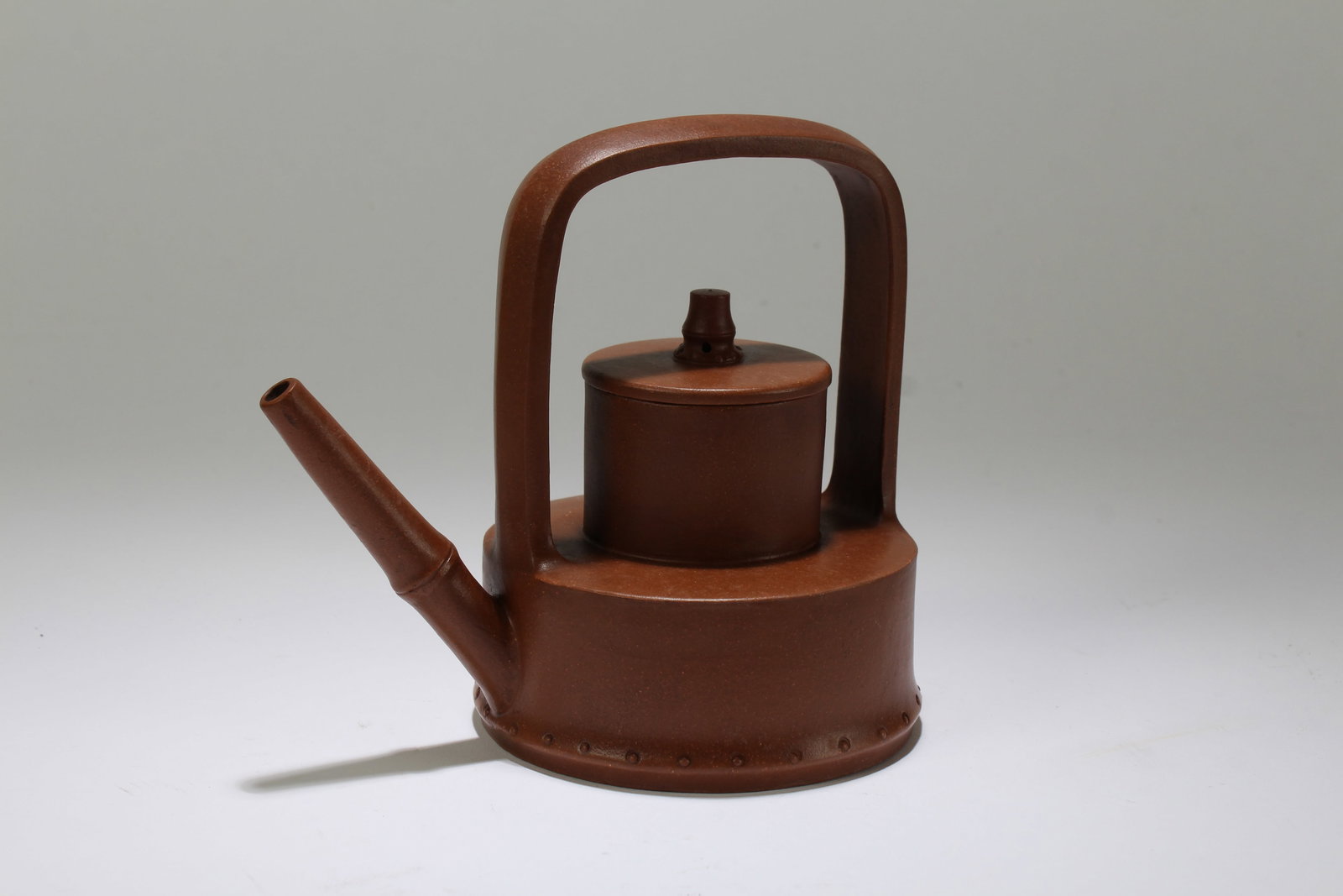 A Chinese High-handled Duo-layer Fortune Tea Pot: A Chinese High-handled Duo-layer Fortune Tea Pot. Height: 5.5 (inch). Length: 6 (inch).