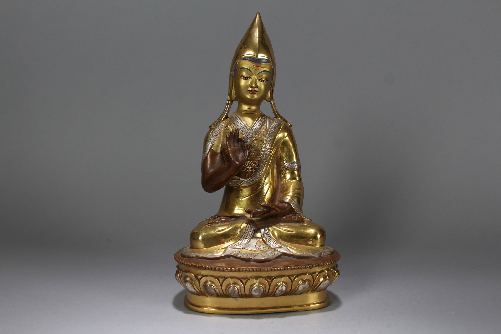 A Chinese Religious Gilt Fortune Buddha Statue: A Chinese Religious Gilt Fortune Buddha Statue. Height: 12 (inch). Length: 6.5 (inch). Width: 5 (inch).