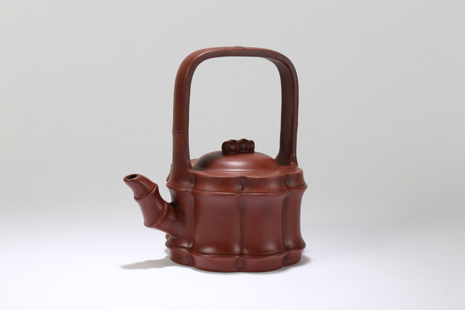 A Chinese High-handled Multi-layer Fortune Tea Pot: A Chinese High-handled Multi-layer Fortune Tea Pot. Height: 7.25 (inch). Length: 6.5 (inch).