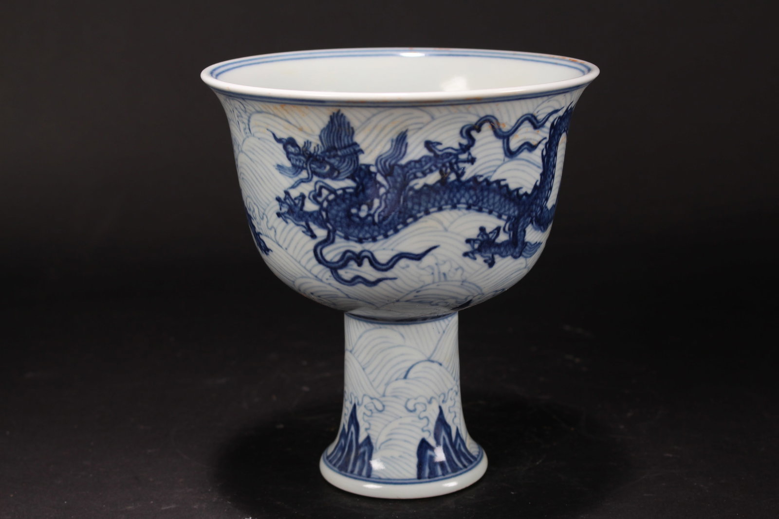 A Chinese Tall-end Porcelain Dragon-fortune Cup: A Chinese Tall-end Porcelain Dragon-fortune Cup. Height: 6.5 (inch). Opening Diameter: 6 (inch).