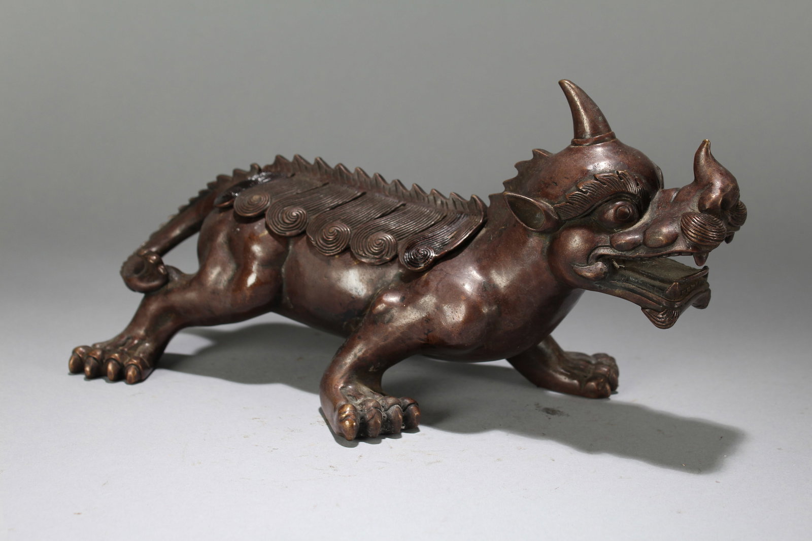 A Chinese Myth-beast Anicent-framing Fortune Statue: A Chinese Myth-beast Anicent-framing Fortune Statue. Height : 5.25 (inch). Width : 10.5 (inch). Length : 3.25 (inch).