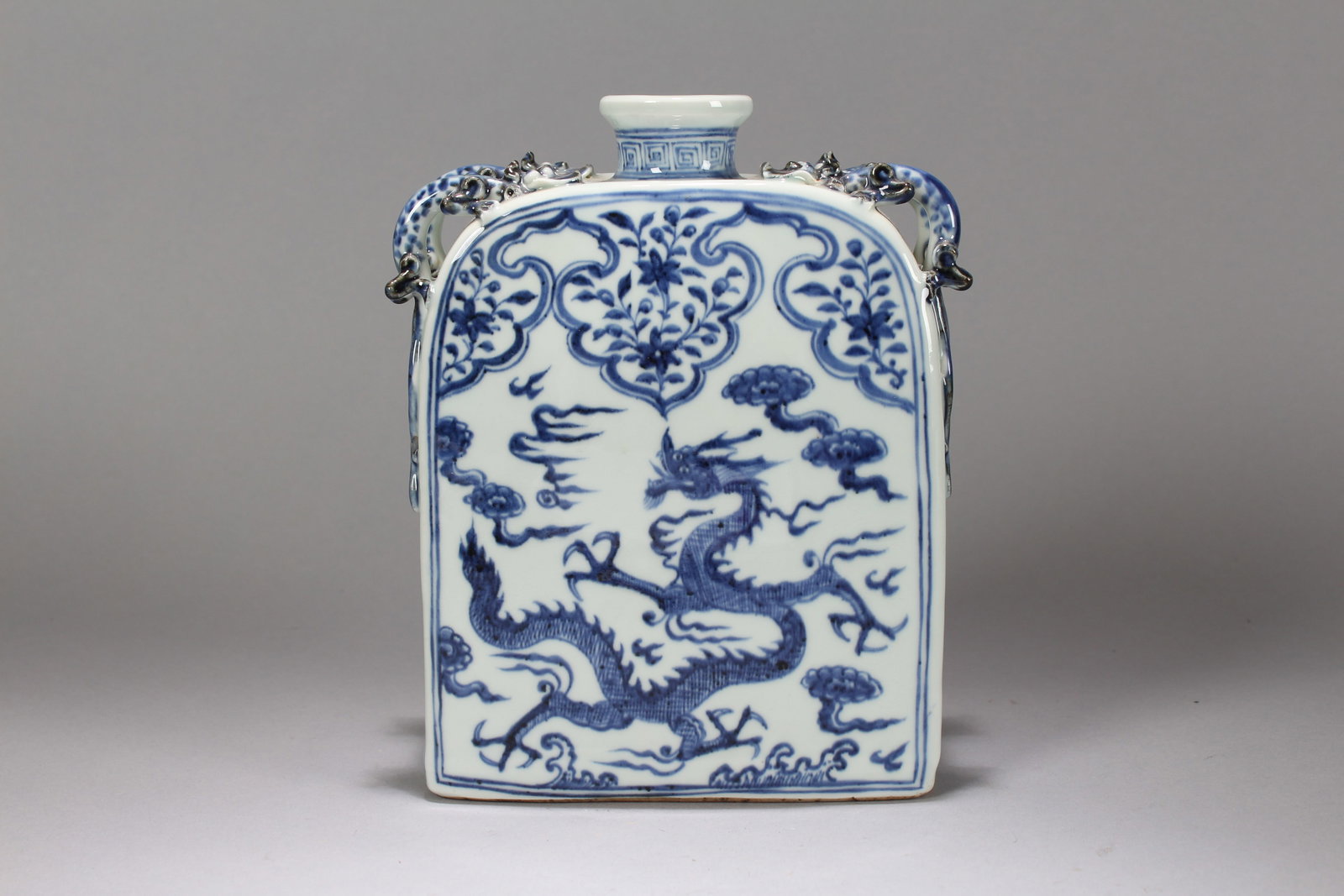 A Chinese Duo-handling Blue and White Dragon-decorating Porcelain Vase: A Chinese Duo-handling Blue and White Dragon-decorating Porcelain Vase. Height: 9 (inch). Width: 6.5 (inch). Length: 3 (inch).