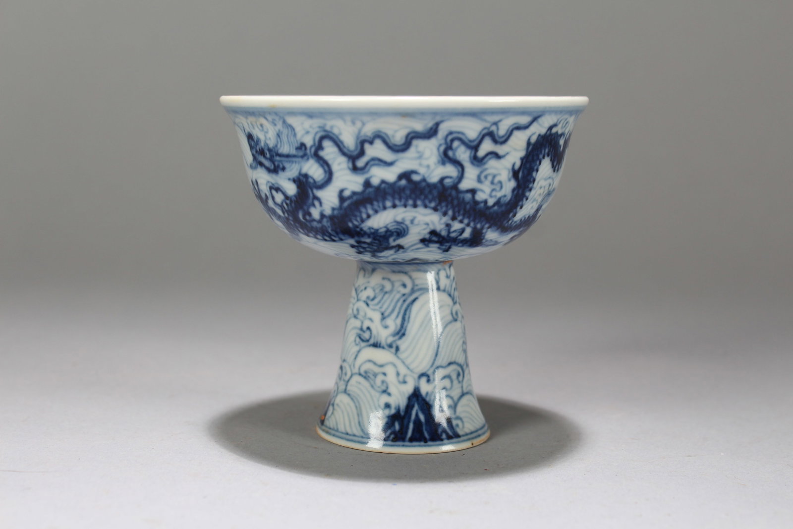 A Chinese Dragon-decorating Blue and White Porcelain Cup: A Chinese Dragon-decorating Blue and White Porcelain Cup. Height: 3.25 (inch). Width: 3.5 (inch).