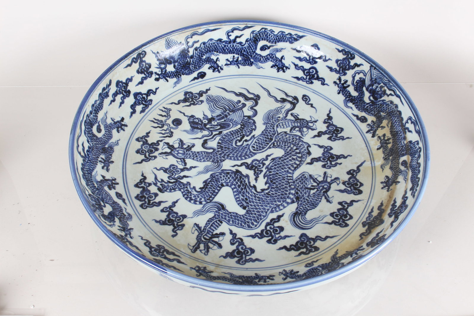 A Chinese Dragon-decorating Massive Blue and White Porcelain Fortune Plate: A Chinese Dragon-decorating Massive Blue and White Porcelain Fortune Plate. Height: 4.25 (inch). Opening Diameter: 23.75 (inch).