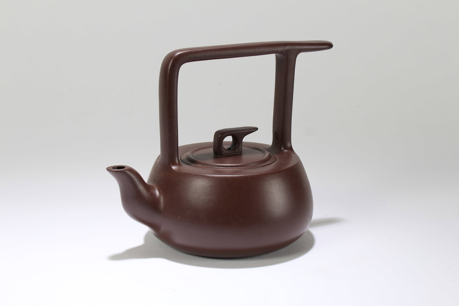 A Chinese Anicent-framing High-handled Fortune Tea Pot: A Chinese Anicent-framing High-handled Fortune Tea Pot. Height: 5.25 (inch). Length: 6.5 (inch).