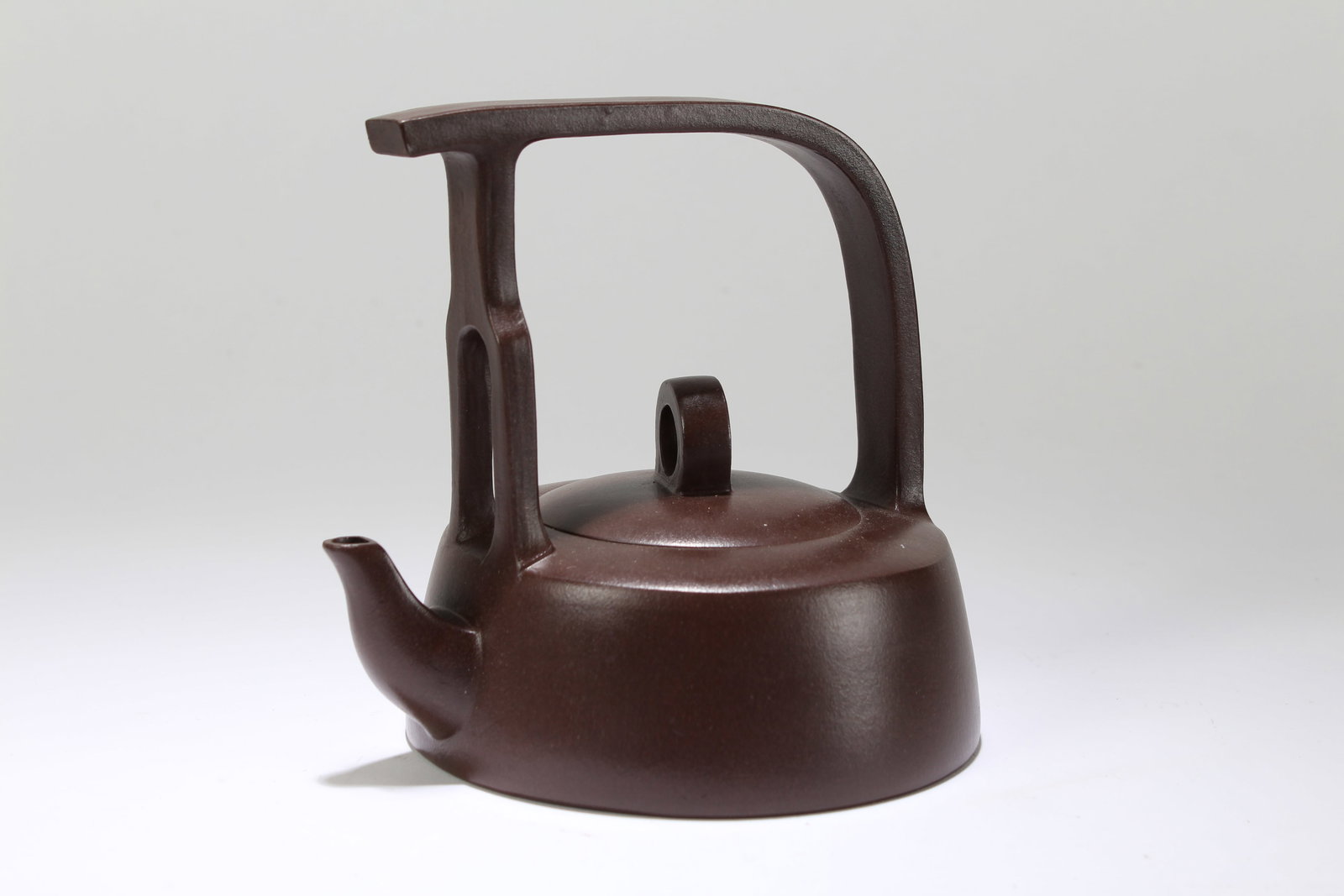 A Chinese Anicent-framing High-handled Fortune Tea Pot: A Chinese Anicent-framing High-handled Fortune Tea Pot. Height: 5.5 (inch). Length: 5.5 (inch).