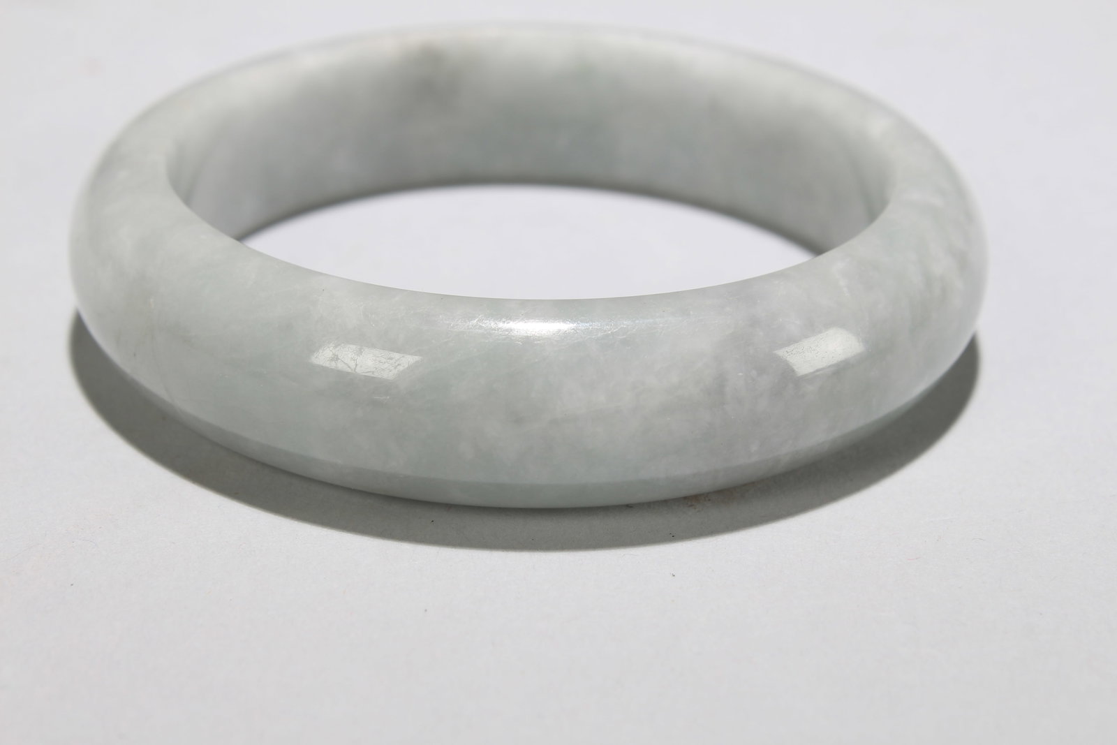 A Chinese Fortune Bangle: A Chinese Fortune Bangle. Opening Diameter: 2.75 (inch).