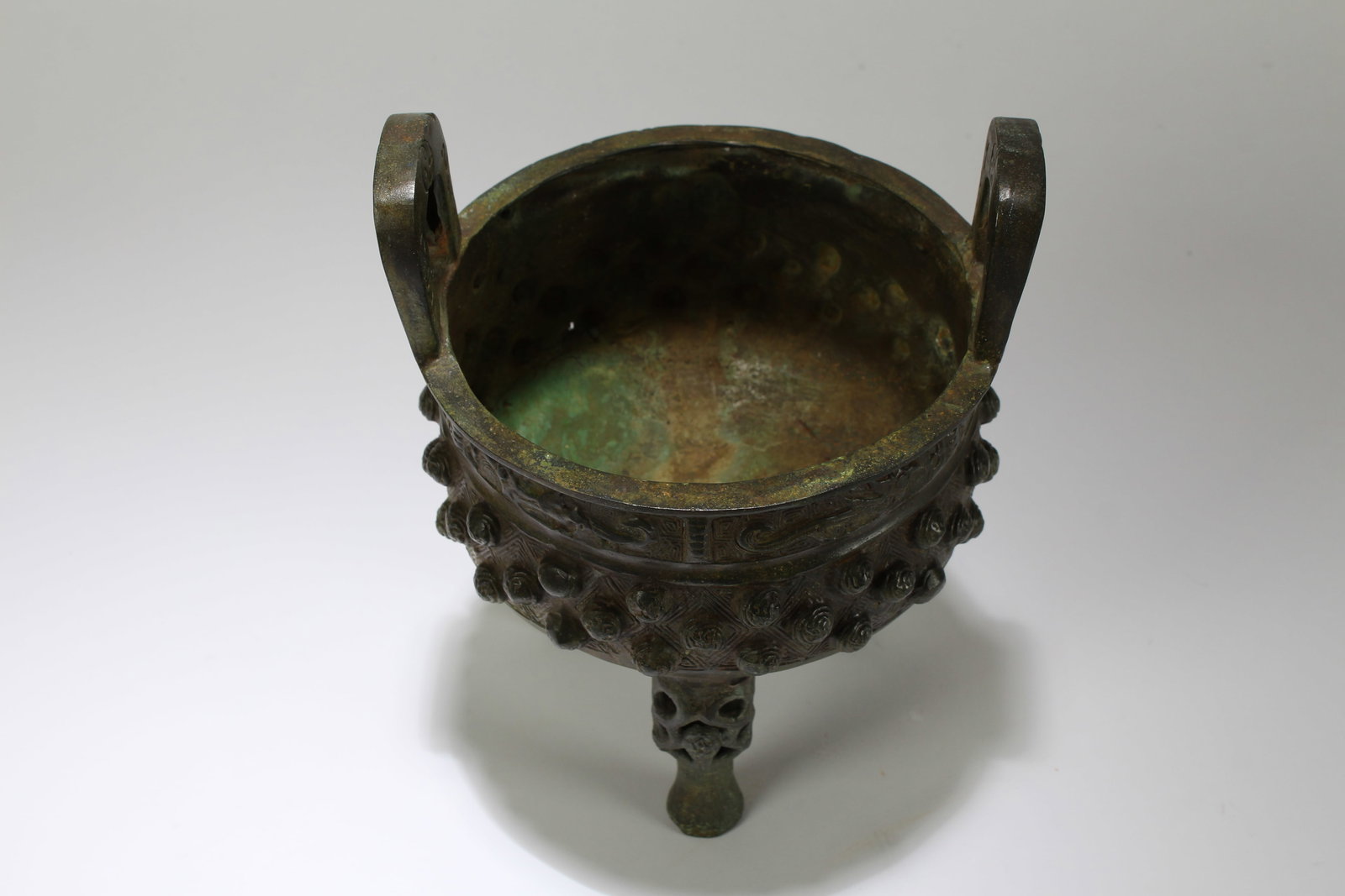 A Chinese Tri-podded Fortune Bronze Vessel: A Chinese Tri-podded Fortune Bronze Vessel. Height: 7.5 (inch). Width: 6 (inch).