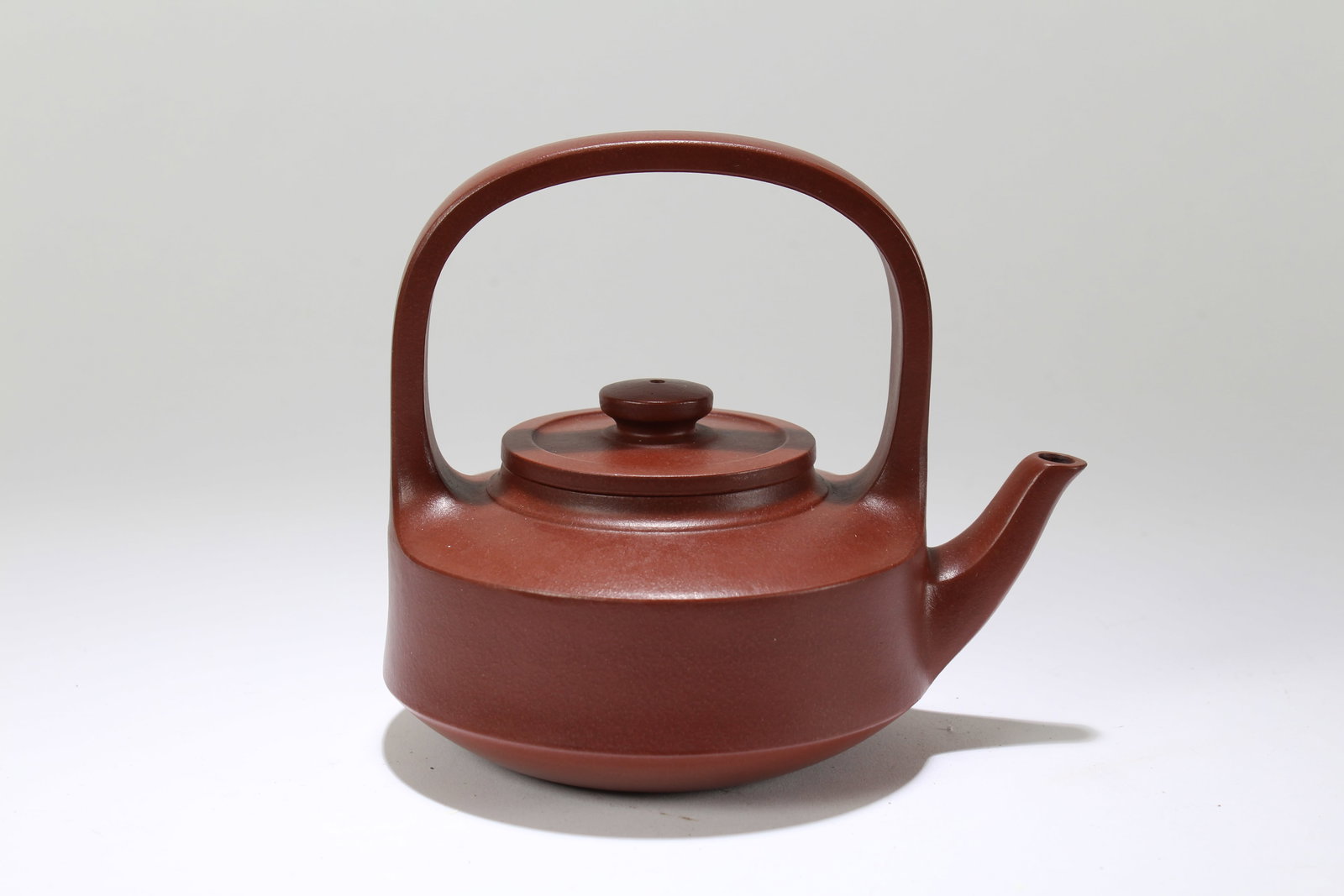 A Chinese Detailed Multi-layer Fortune High-handled Tea Pot: A Chinese Detailed Multi-layer Fortune High-handled Tea Pot. Height: 5.75 (inch). Length: 6.25 (inch).