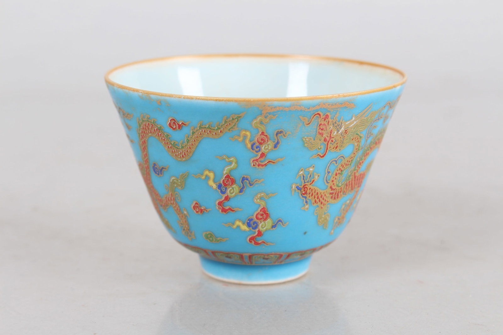 A Chinese Dragon-decorating Porcelain Fortune Cup: A Chinese Dragon-decorating Porcelain Fortune Cup. Height: 2 (inch). Opening Diameter: 2.75 (inch).